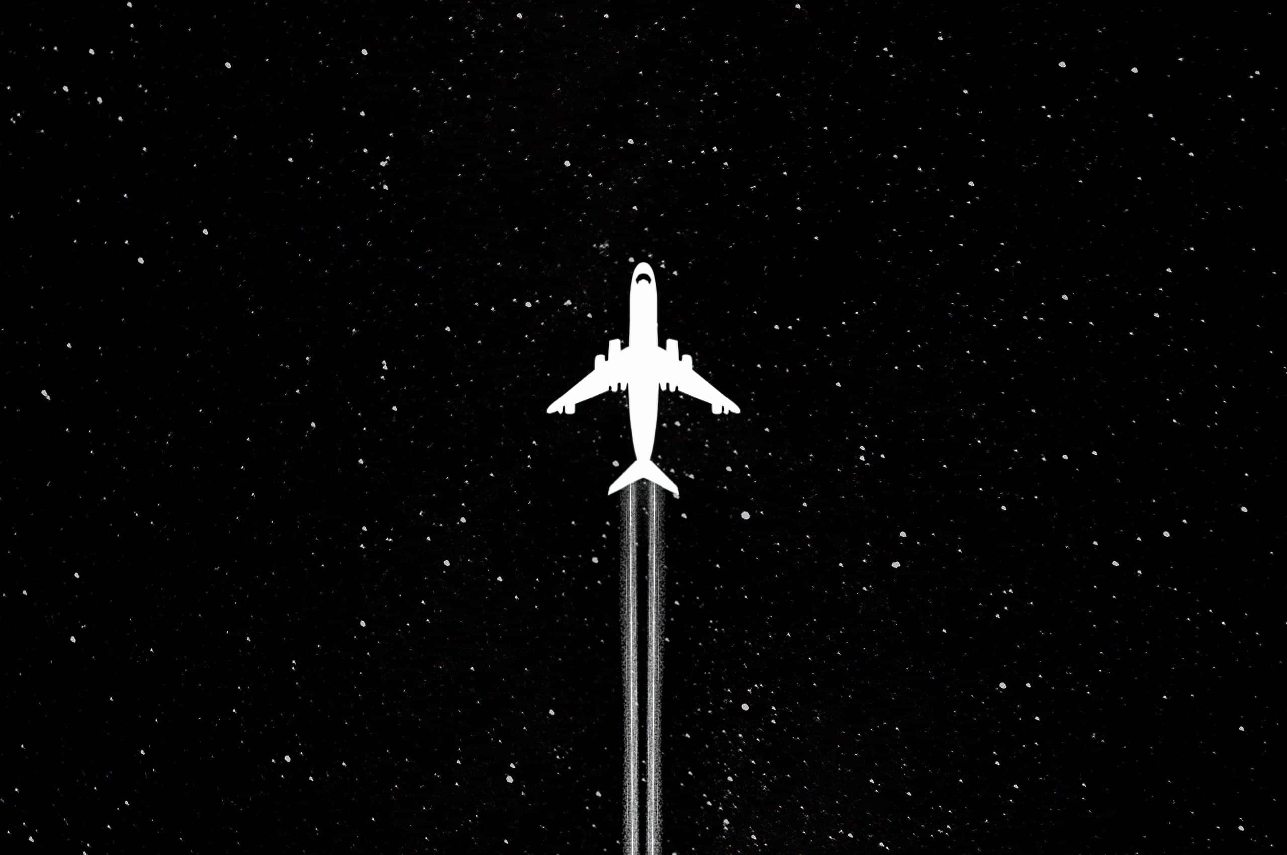 夜空中飄渺星點的美學暗色背景 壁紙 — 一架純白色的飛機在繁星點點的夜空中翱翔，留下一道發光的凝結尾跡。