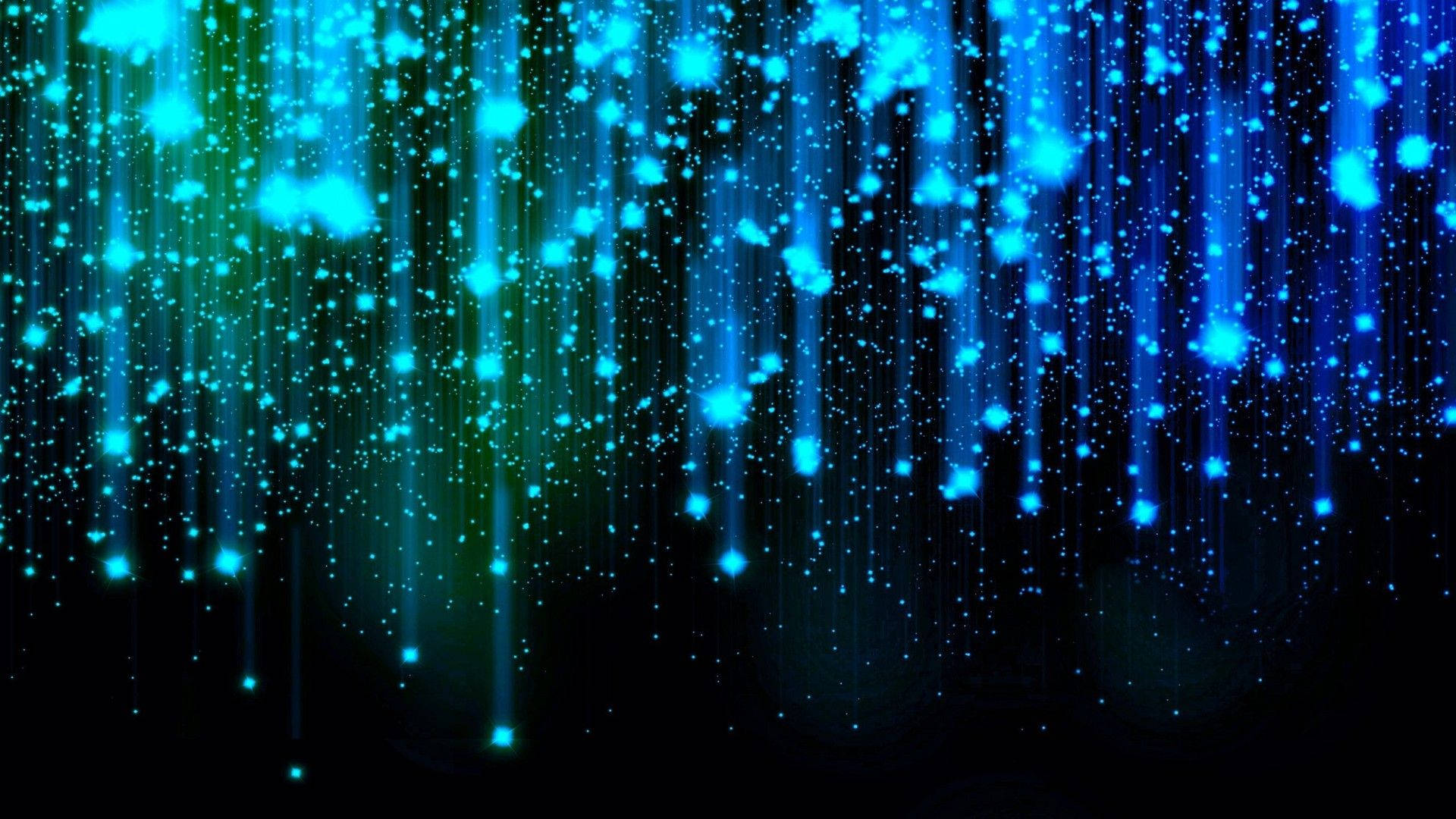 夜空之美 壁紙 — 充滿活力的藍色和綠色發光粒子像數位雨一樣在深黑色背景上傾瀉而下。