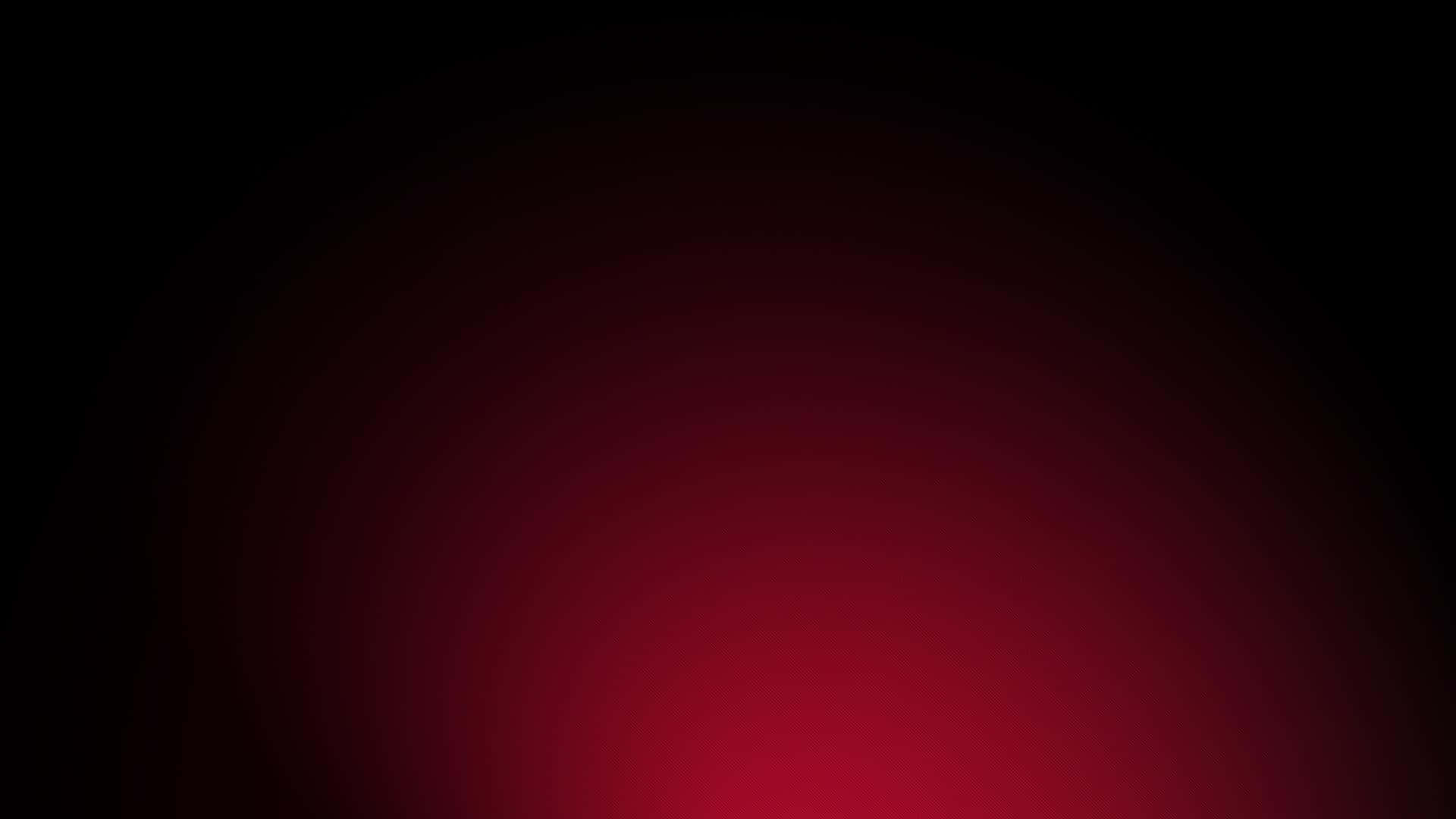 黑色背景上從中心發光的抽象紅色漸變