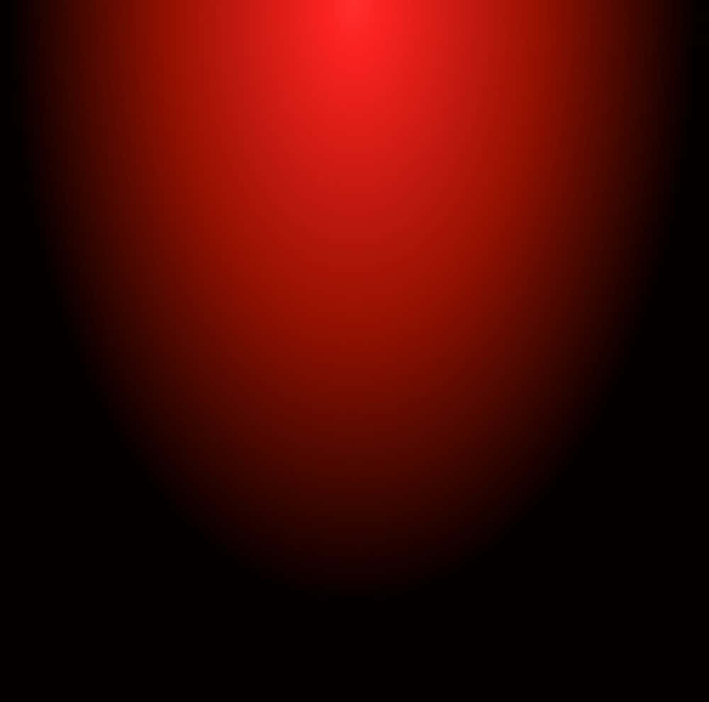 夜色街景，遠處紅光點綴 壁紙 — 一個發光的紅色漸變球體逐漸融入黑色，營造出極簡的宇宙或抽象光效。