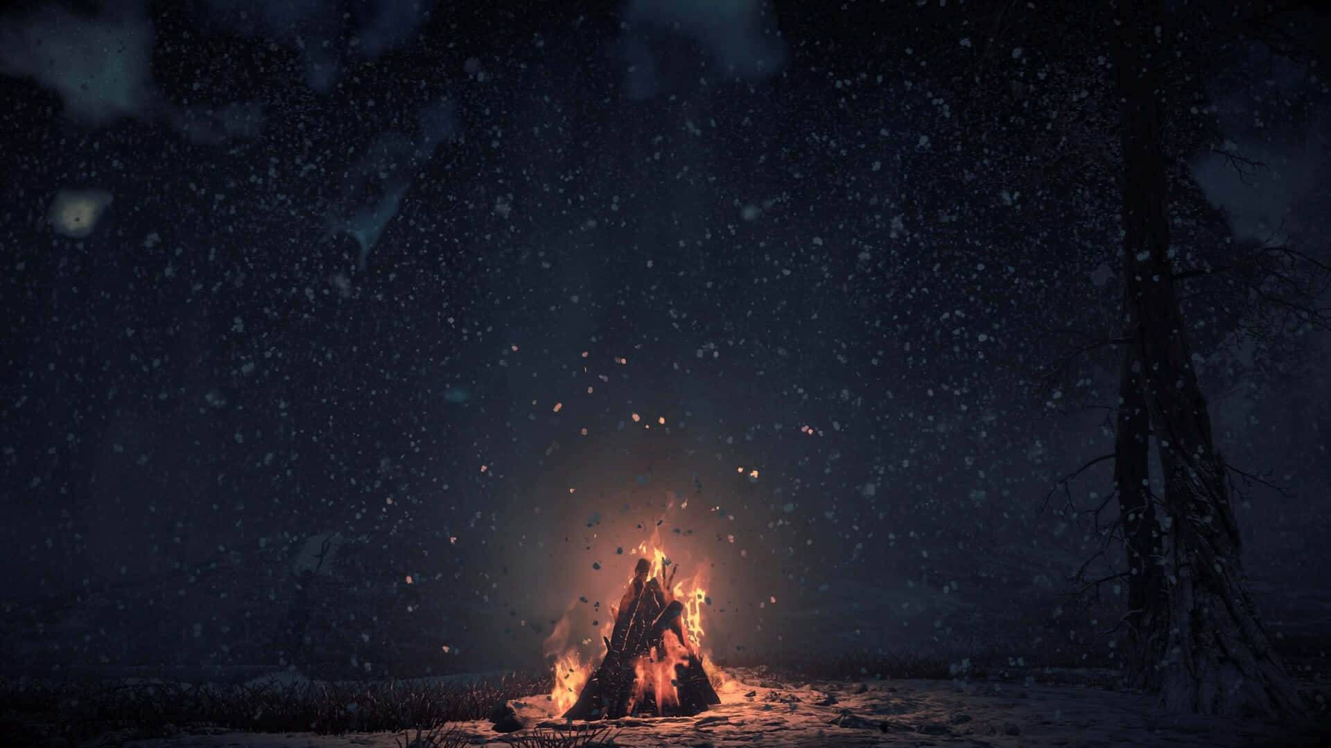 夜間森林露營地營火 壁紙 — 熊熊營火在雪夜天空下溫暖地發光，伴隨著飄落的雪花和黑暗中的光禿樹木。