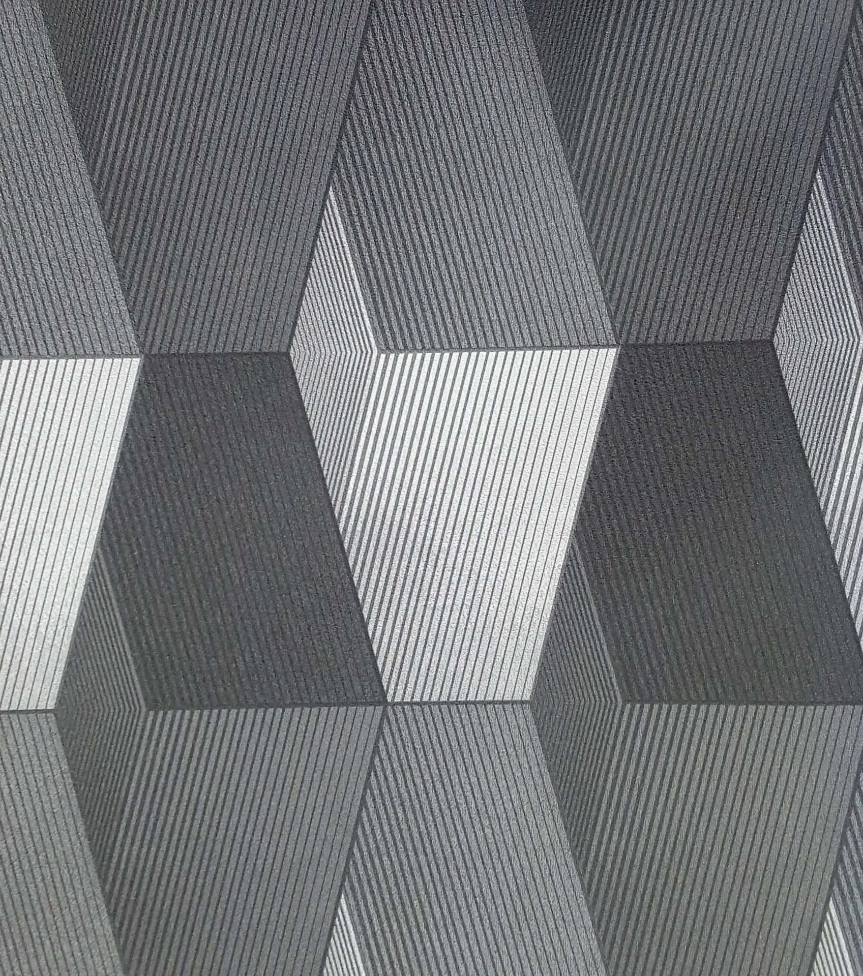 抽象幾何牆紙，帶有灰階3D立方體錯覺。