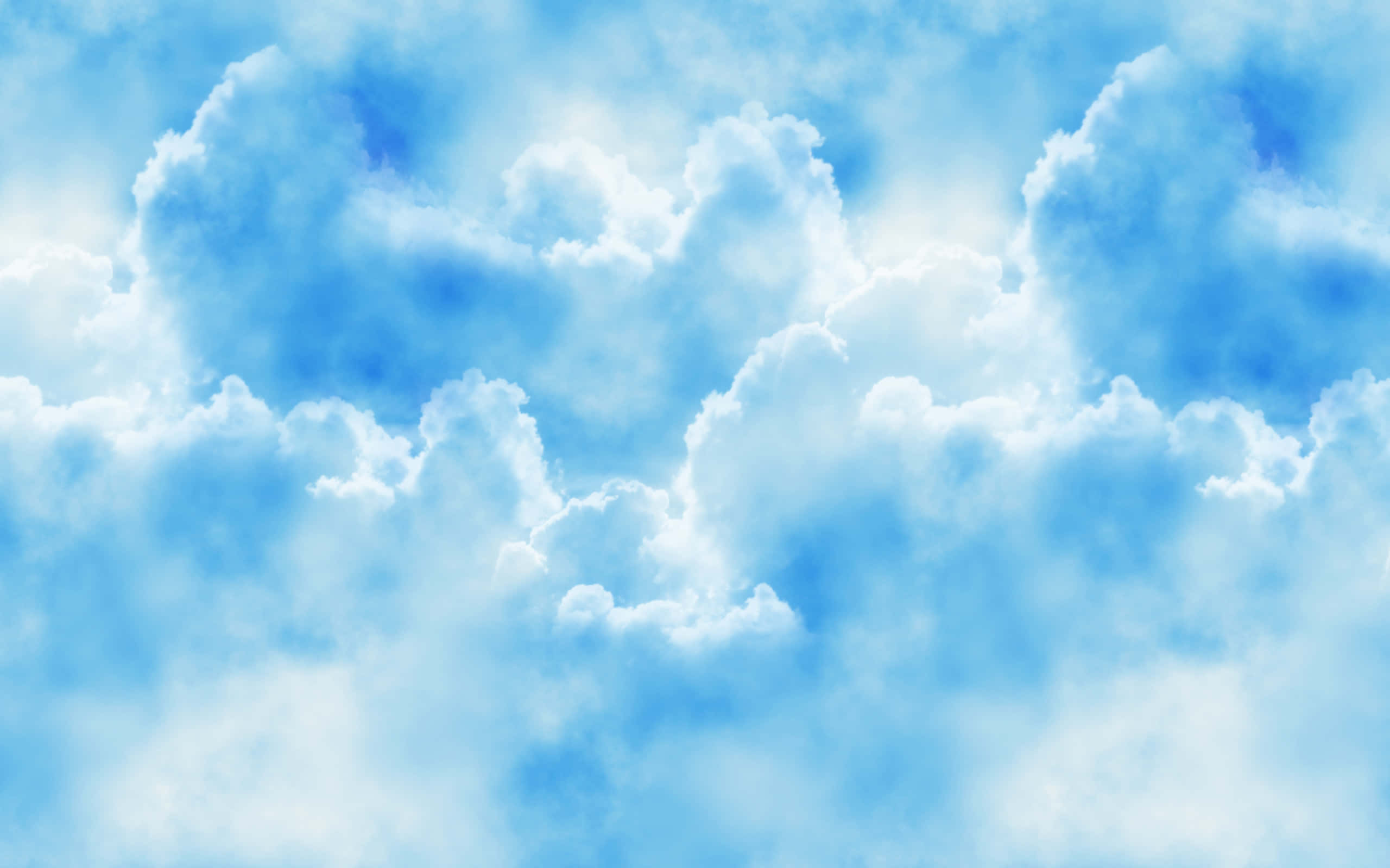 夢幻藍天與蓬鬆白雲 壁紙 — 廣闊的天空中，蓬鬆的白雲在明亮的藍色畫布上飄移。