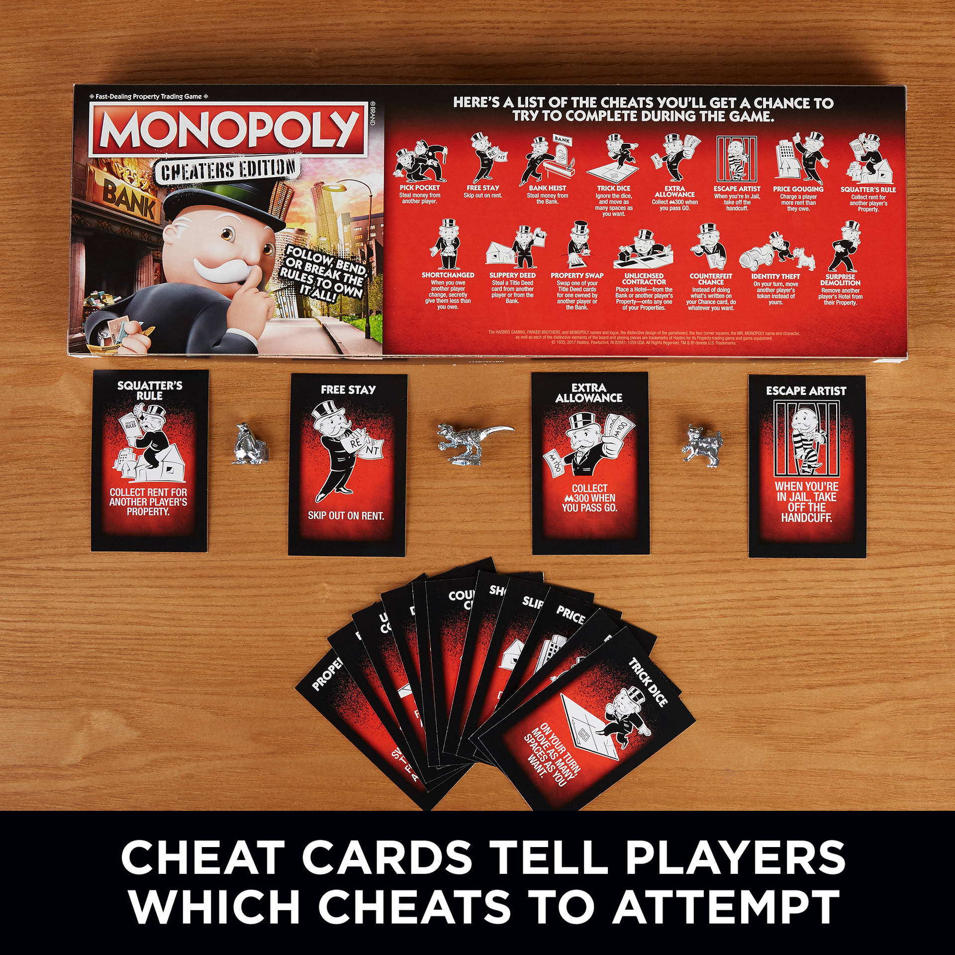 大富翁作弊版遊戲盒及作弊卡在木桌上。