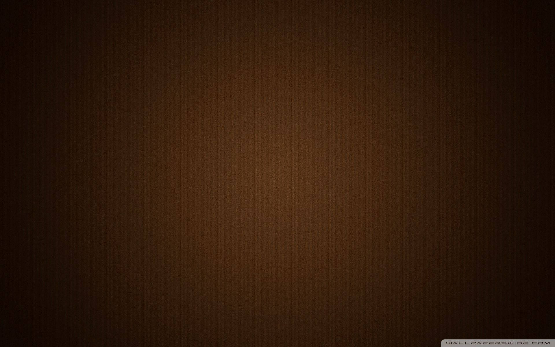 帶有細微紋理的柔和棕色漸變背景。