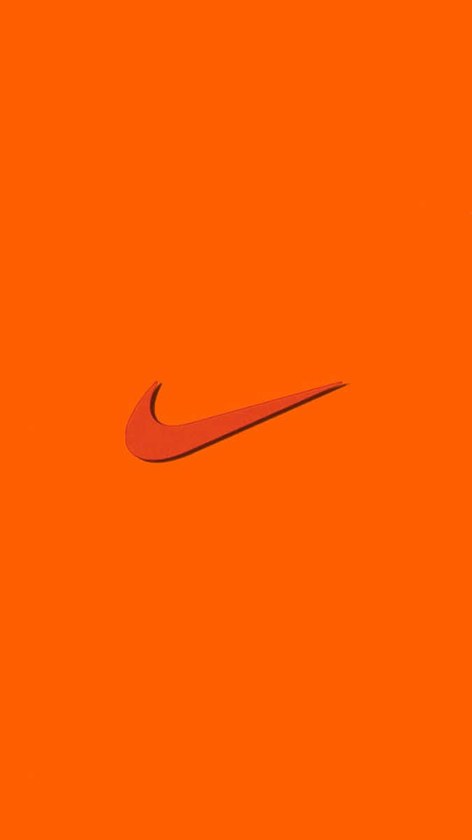 Cool Orange 桌布 壁紙 — 大膽的橙色背景，中央放置了稍深橙色的Nike swoosh標誌，帶有微妙的陰影效果。