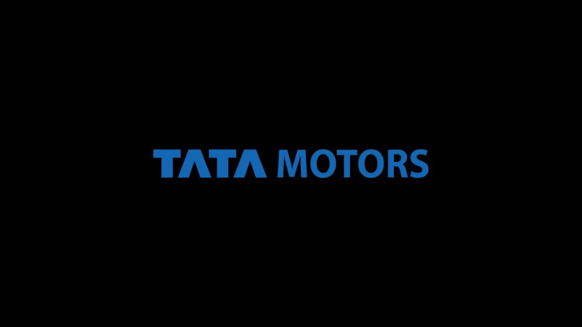 Tata Motors 桌布 壁紙 — 大膽的藍色 Tata Motors 標誌居中於純黑色背景上，搭配簡潔現代的字體設計。