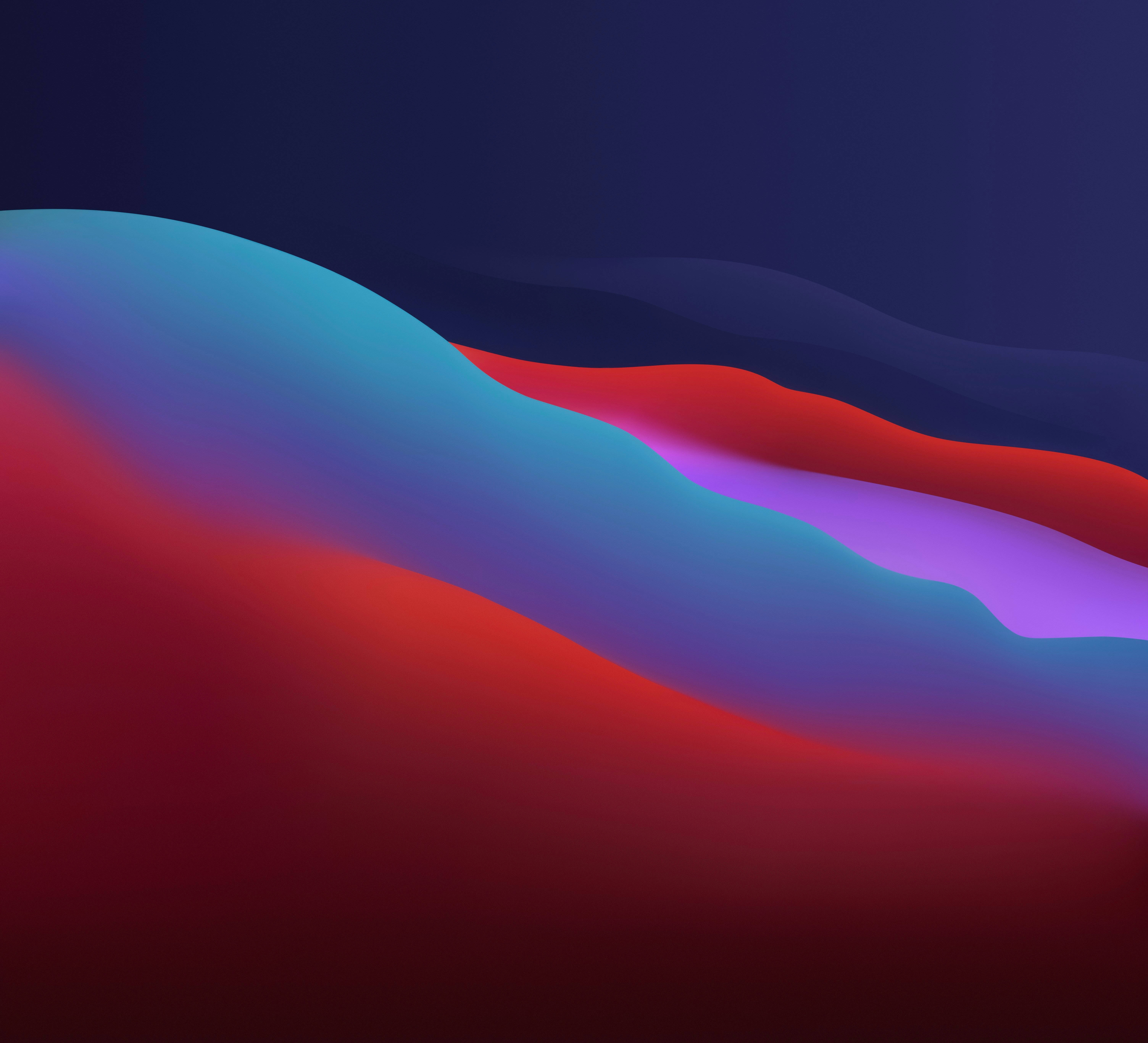 大蘇爾暗黑模式 macOS Monterey 壁紙 — 充滿活力的紅色、藍色和紫色抽象波浪在深色漸變背景上流動。