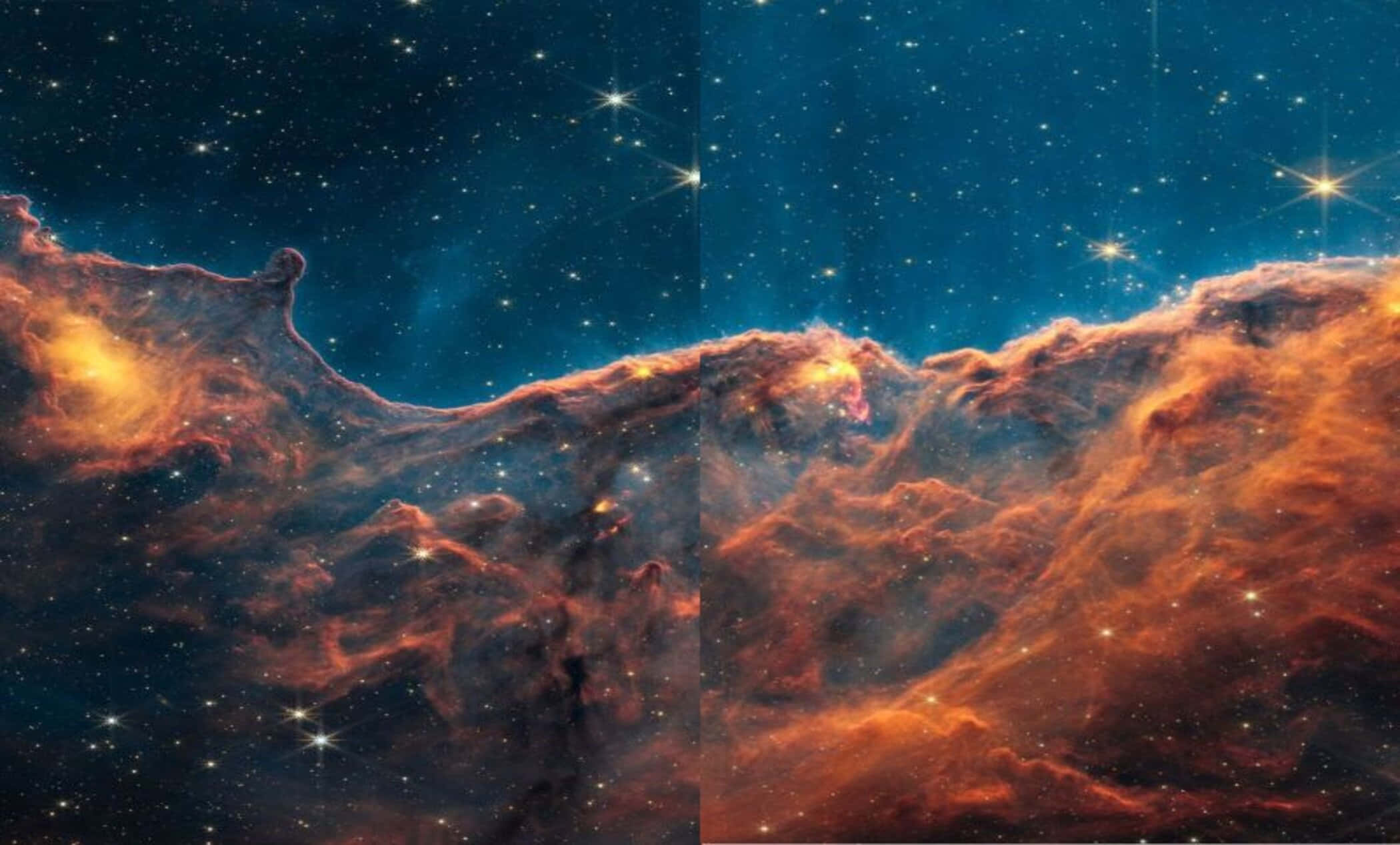 天文學船底座星雲橙藍色調 壁紙 — 充滿活力的橙色和藍色宇宙星雲，在深空中帶有發光的星星和旋轉的氣體雲。