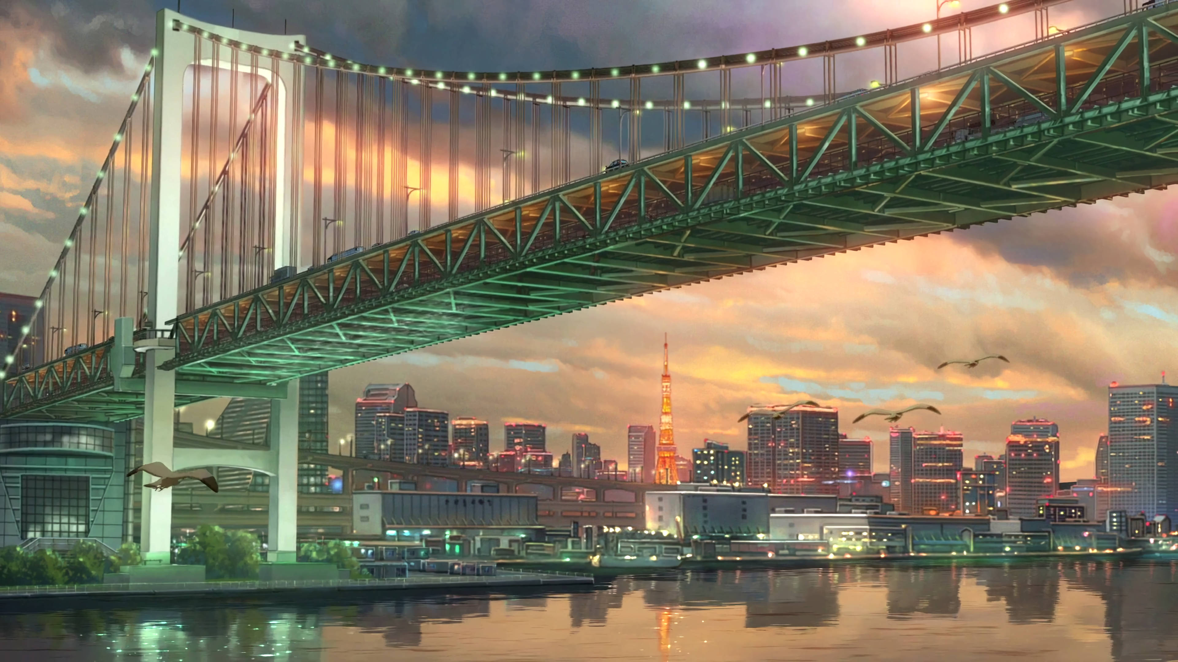 《天气之子》彩虹大橋 壁紙 — 一條發光的彩虹橋在日落時橫跨河流，東京塔和城市燈光倒映在水中。
