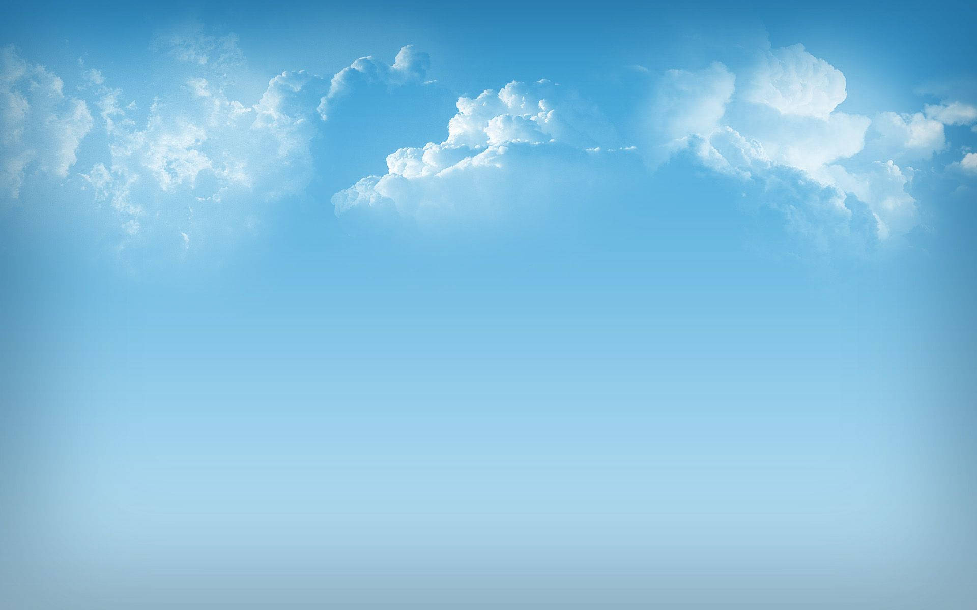 天空中的自然之美 壁紙 — 廣闊寧靜的天空，蓬鬆的白雲在漸變藍色畫布上飄移。