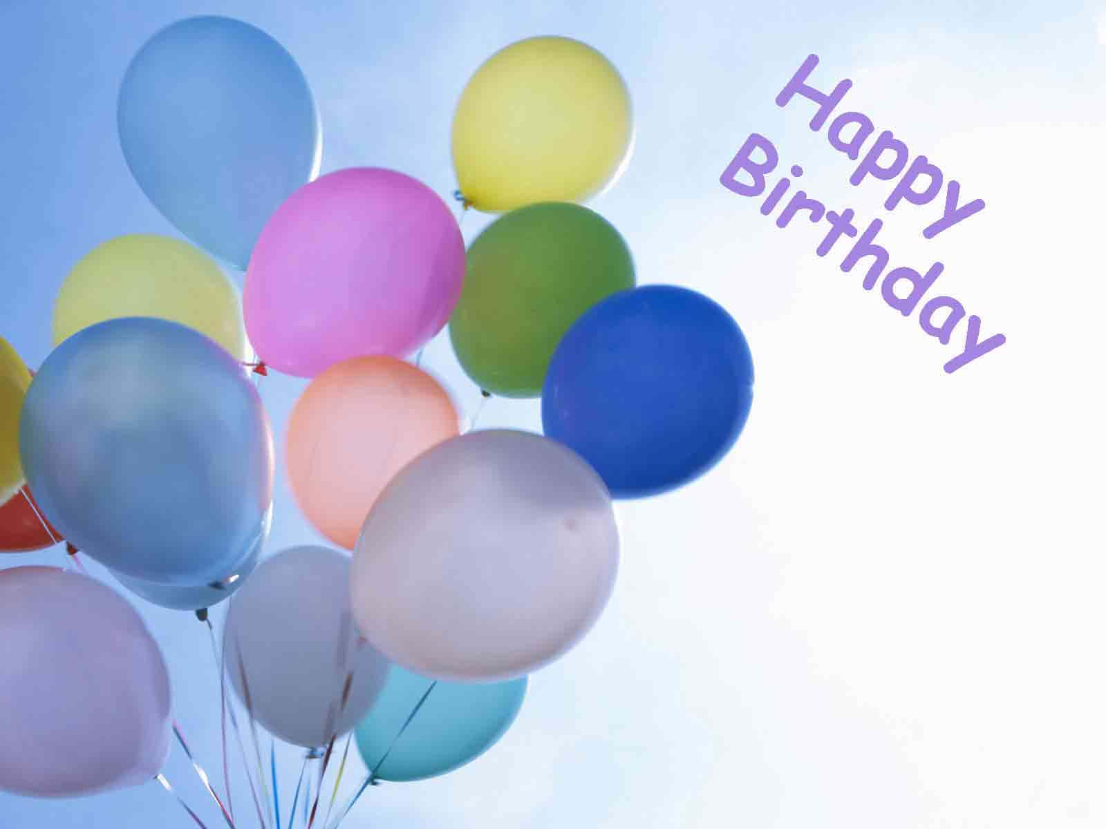 色彩繽紛的氣球在天空中飄浮，帶有Happy Birthday文字。