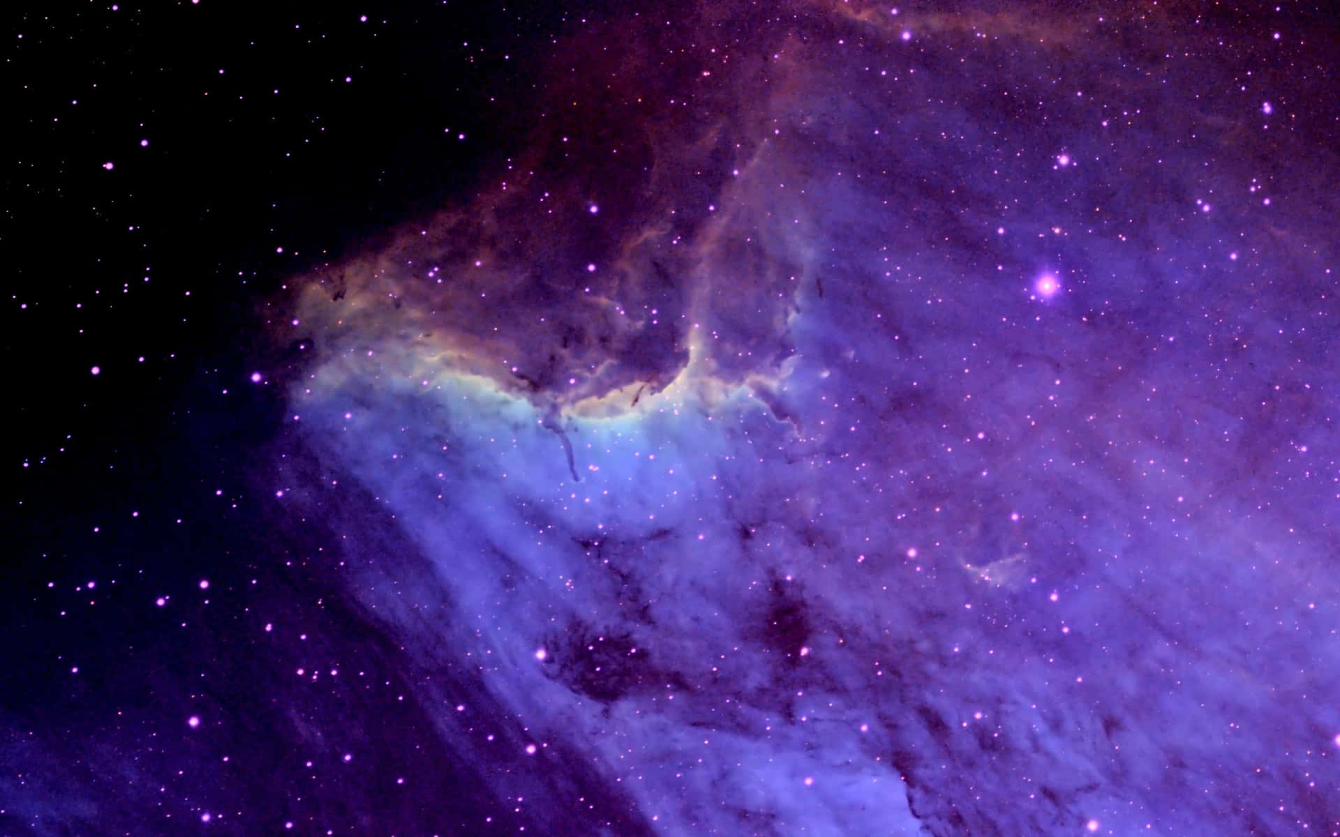 在深空中閃耀著星星的鮮豔紫色和藍色星雲。