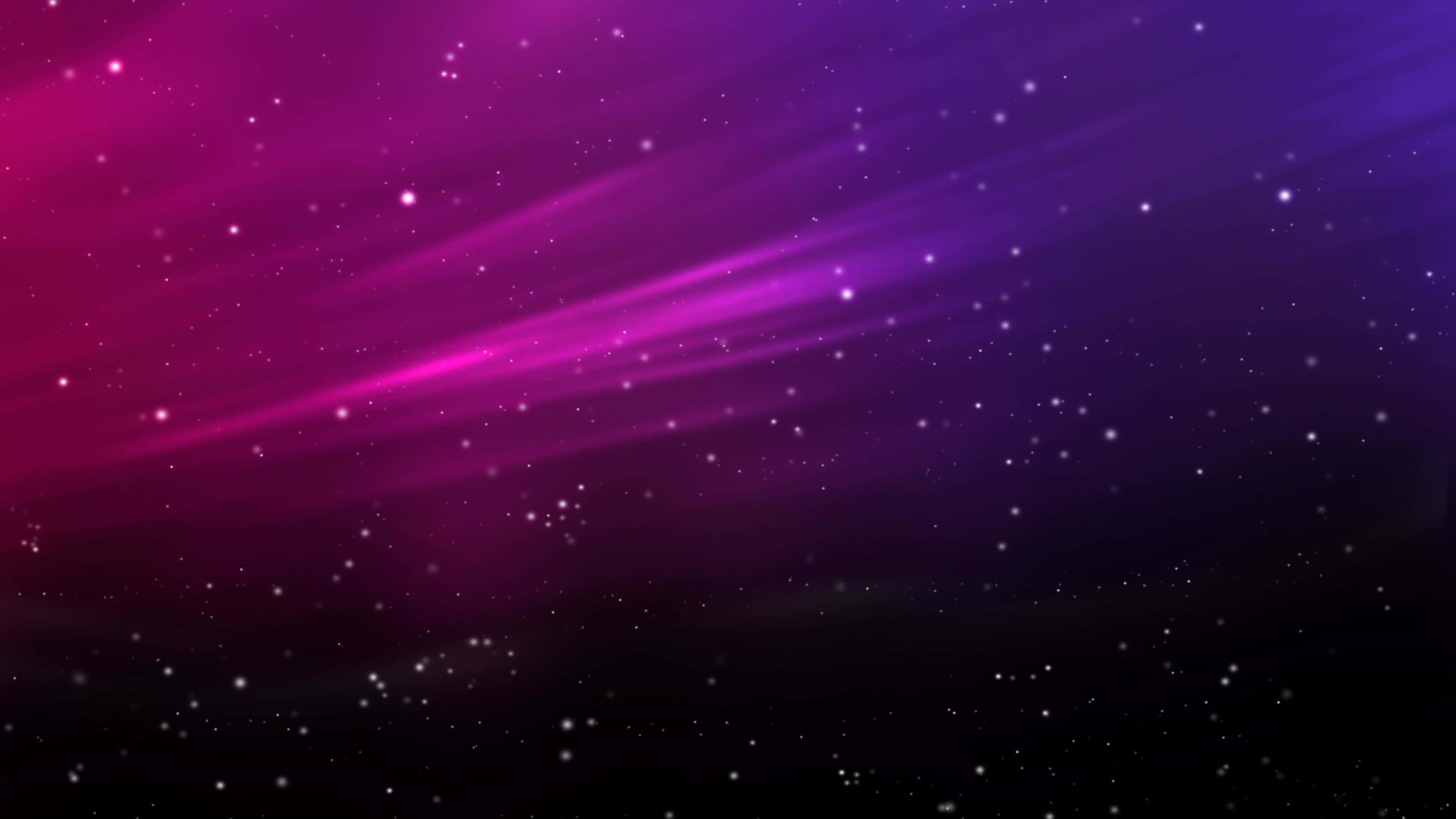 太空中的絢麗星雲 壁紙 — 充滿活力的宇宙射線劃過漸變紫色和洋紅色的星場，散落著發光的粒子。