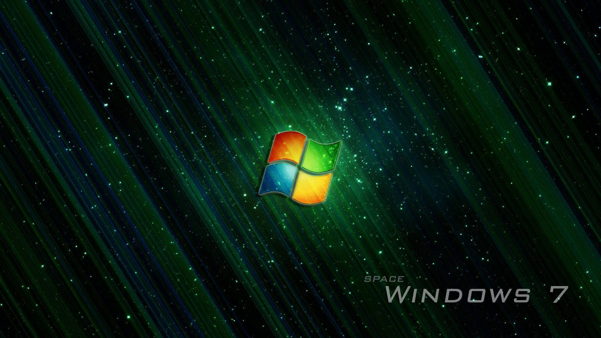 太空主題深色 Windows 帶標誌 壁紙 — Windows 7 標誌漂浮在充滿活力的綠色星空之中，伴隨著宇宙射線和發光粒子。