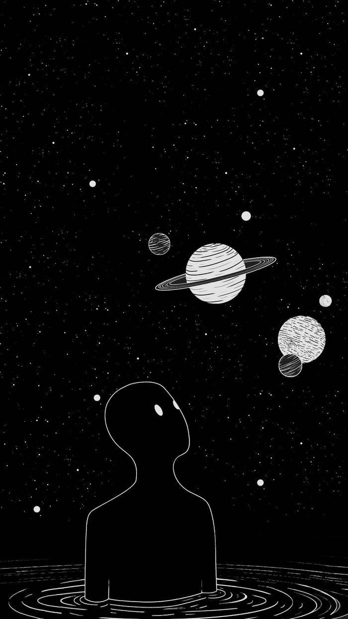 水中人物的剪影，觀看太空中的行星和星星。
