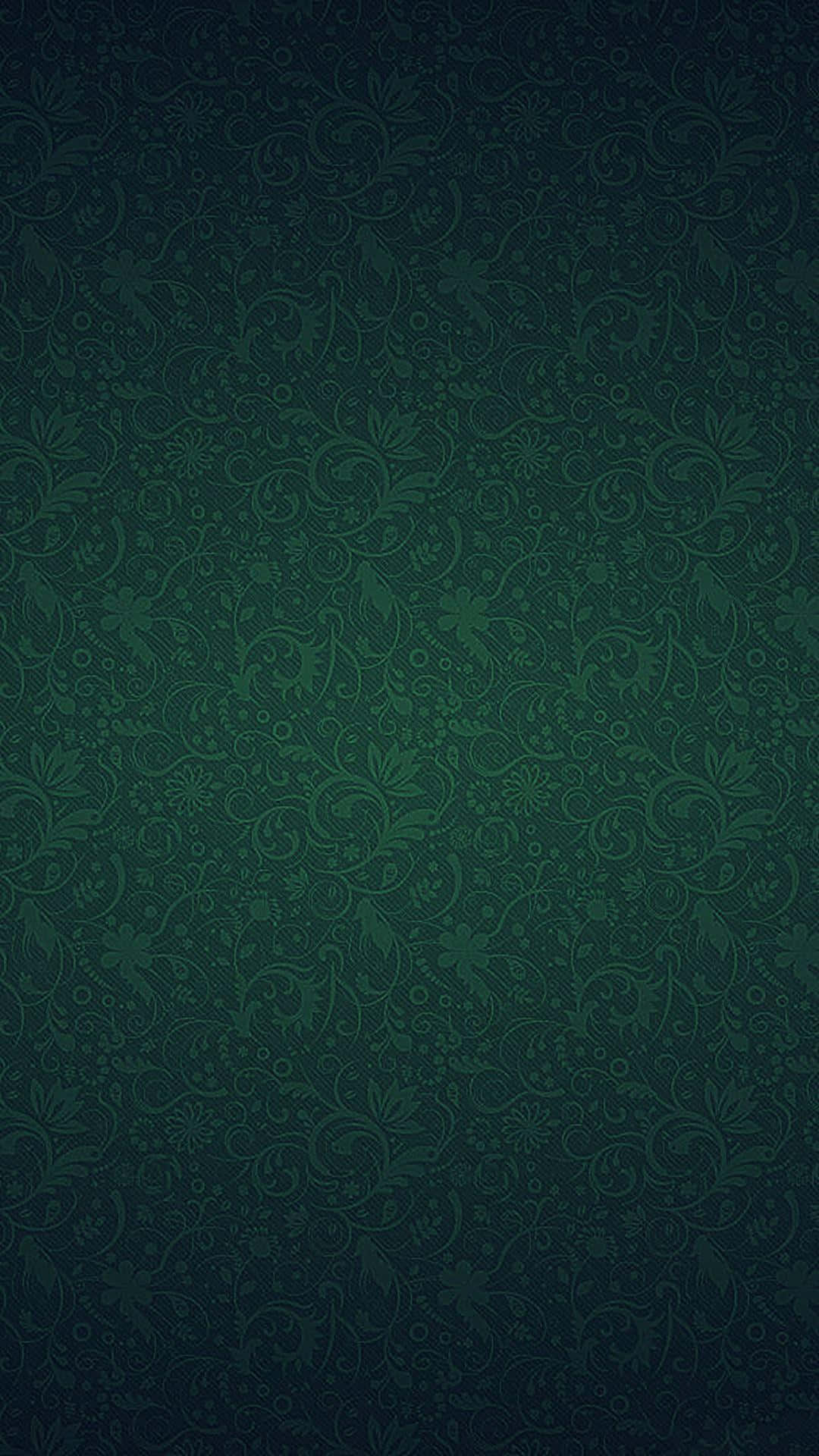 奢華翡翠綠背景 壁紙 — 一款濃郁的深綠色壁紙，帶有複雜的漩渦花卉圖案，在表面微妙地漸變。