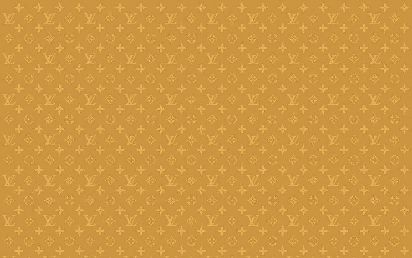 芥末黃色背景上的金色 Louis Vuitton 字母組合圖案。