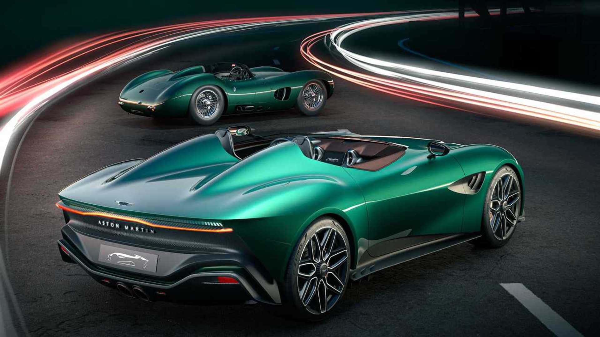 奢華阿斯頓·馬丁 壁紙 — 兩輛時尚的綠色 Aston Martin 跑車在黑暗的賽道上滑行，周圍有發光的紅色和白色光軌旋轉。
