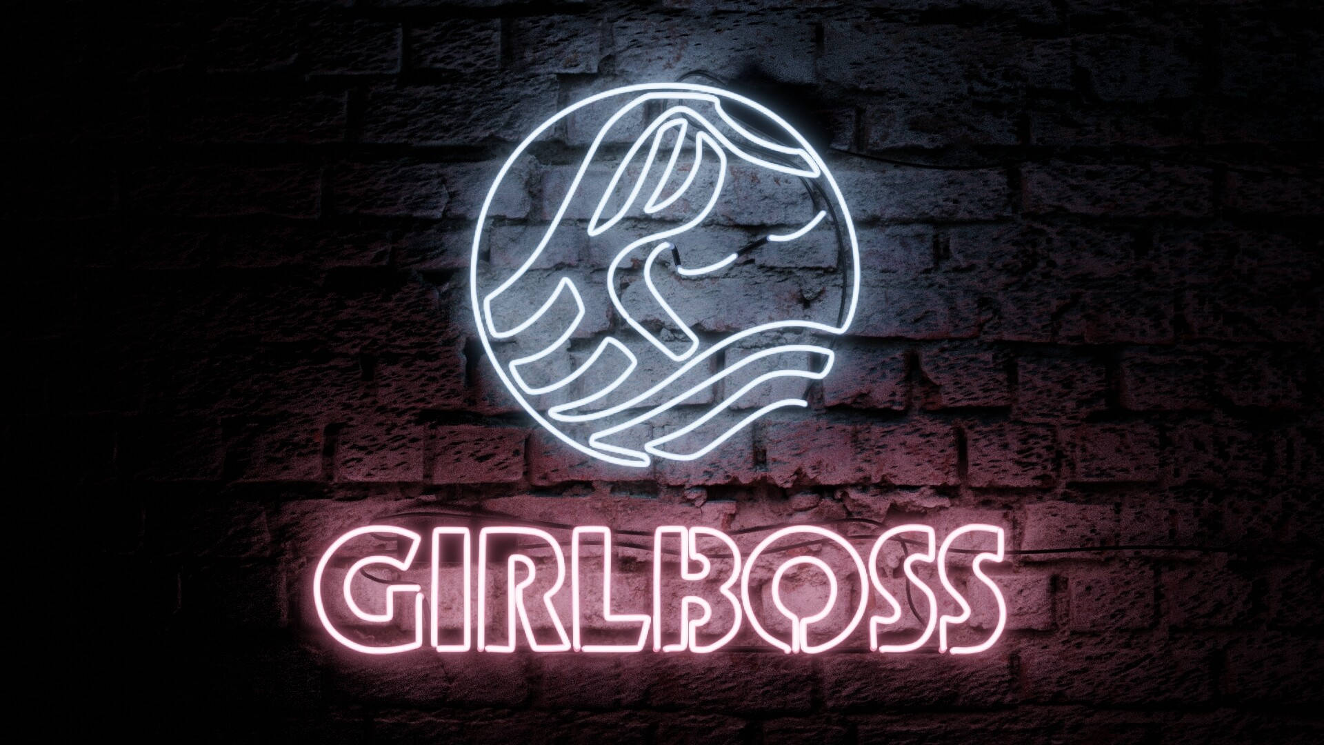 夜間磚牆上帶有地球儀符號的「GIRLBOSS」霓虹燈牌