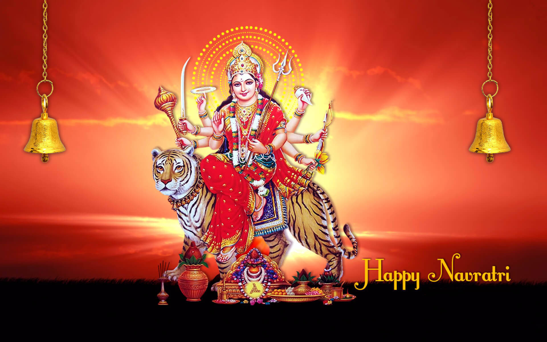 Indian 桌布 壁紙 — 女神杜爾迦騎著老虎，背景是火熱的橙色日落，掛著鈴鐺，並有「Happy Navratri」文字。