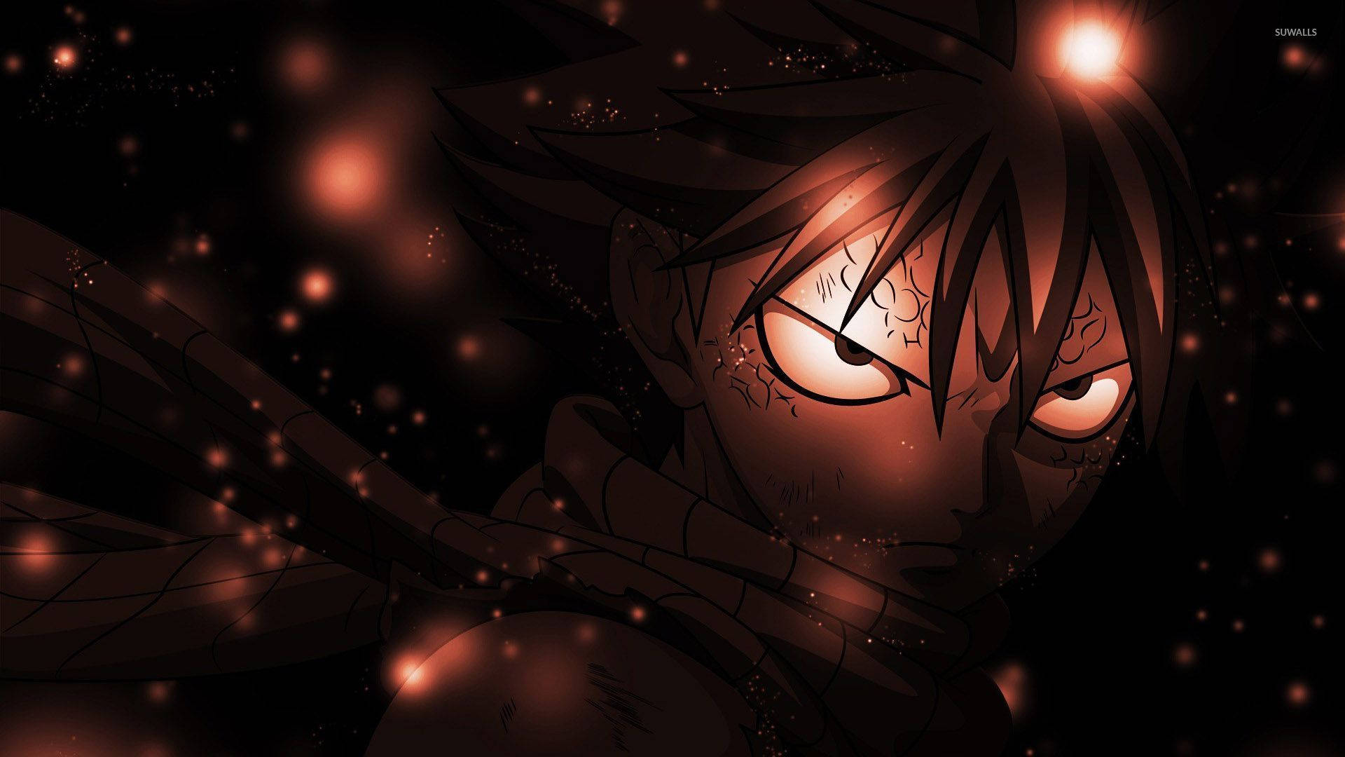 《妖精的尾巴》納斯·德拉格尼爾 壁紙 — 一個兇猛嘅動漫角色，擁有發光嘅橙色眼睛同深色頭髮，喺繁星點點嘅夜空背景下強烈凝視。