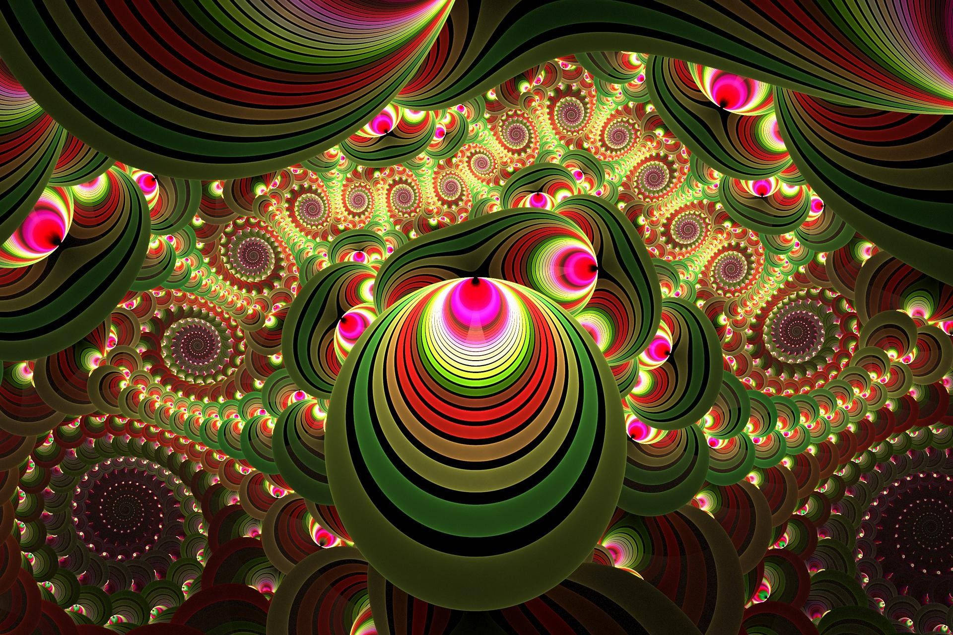 嬉皮士抽象色彩圖案 壁紙 — 充滿活力的分形圖案在催眠般的同心圓中旋轉，帶有霓虹粉、綠和紅色調，營造出迷幻的隧道效果。