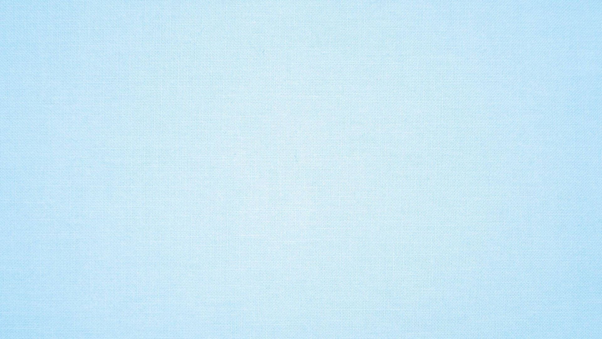 用於設計項目的淺藍色布料紋理背景。