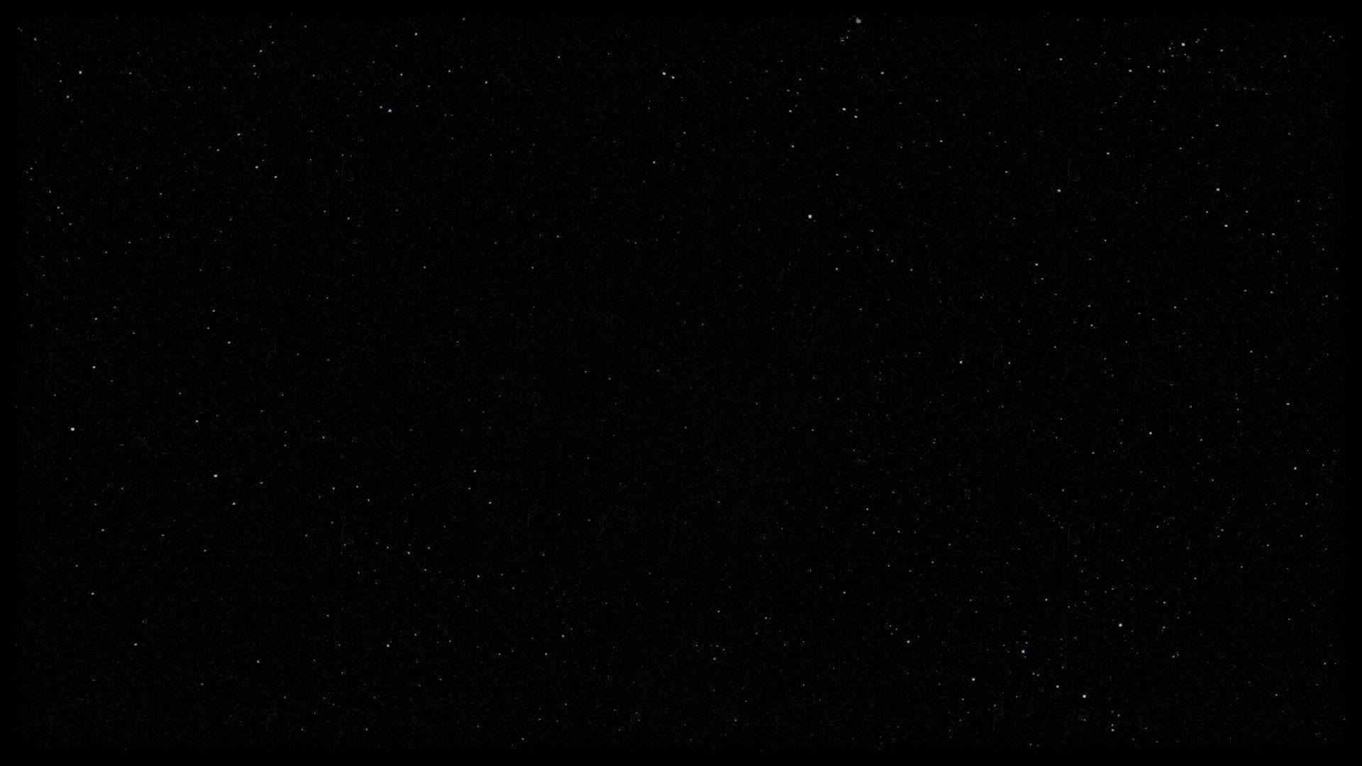 深邃的黑色虛空背景下，充滿了無數遙遠星星的星空夜空。