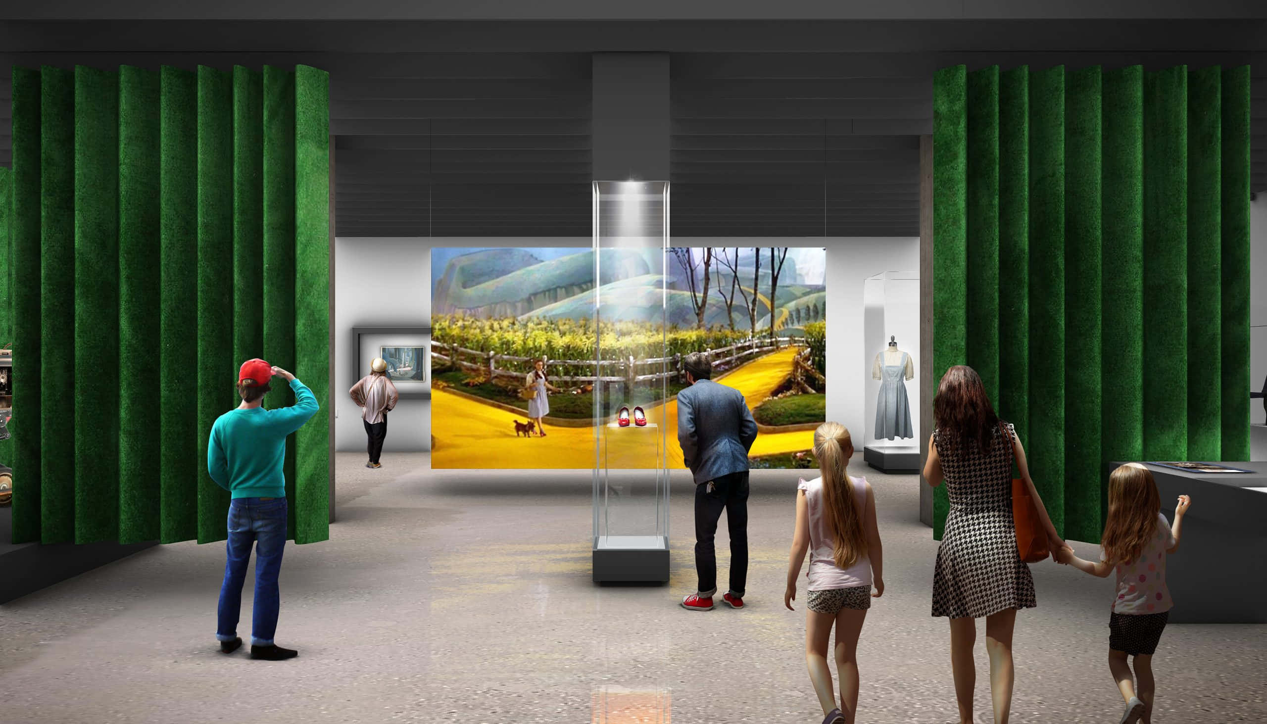 學院動畫博物館展覽廳圖 壁紙 — 訪客在一個現代畫廊中欣賞一件大型、充滿活力的黃色磚路藝術品，畫廊有綠色窗簾和玻璃展示櫃。