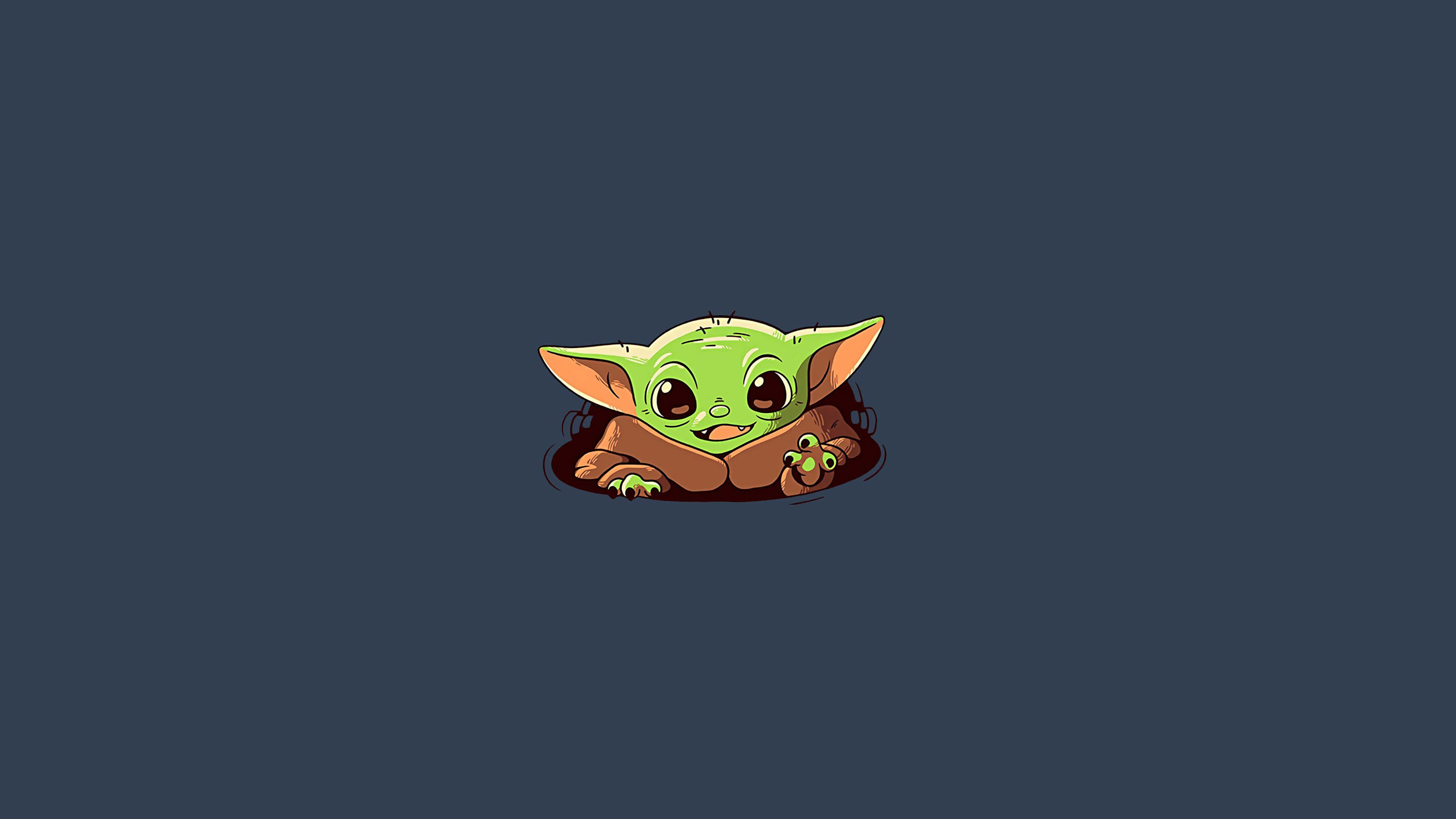 宇宙中最可愛的生物——Baby Yoda 壁紙 — 一個可愛的綠色小尤達從棕色毯子裡探出頭來，背景是深藍色。
