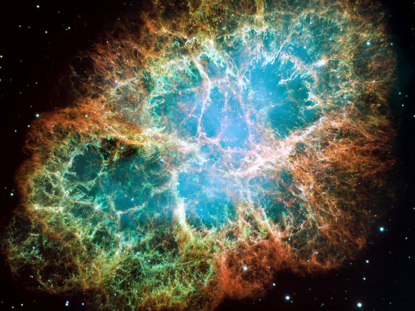 充滿活力的青綠色和橙色宇宙星雲，帶有發光的絲狀物和遙遠的恆星。