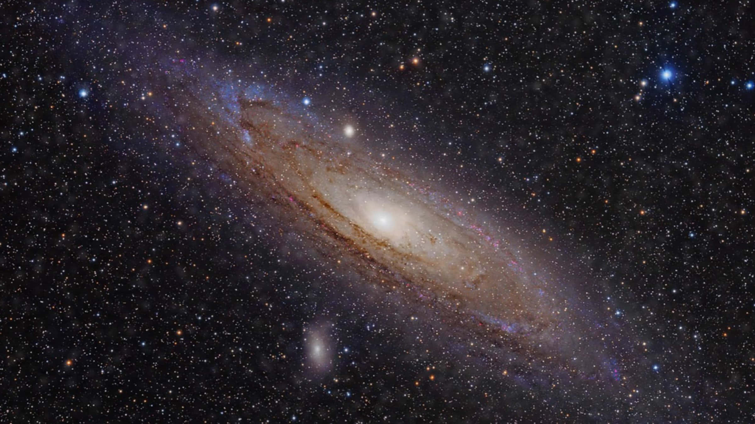宇宙深處的壯麗橢圓星系 壁紙 — 一個令人嘆為觀止的螺旋星系，擁有發光的旋臂和無數恆星，背景是深邃的宇宙黑色。