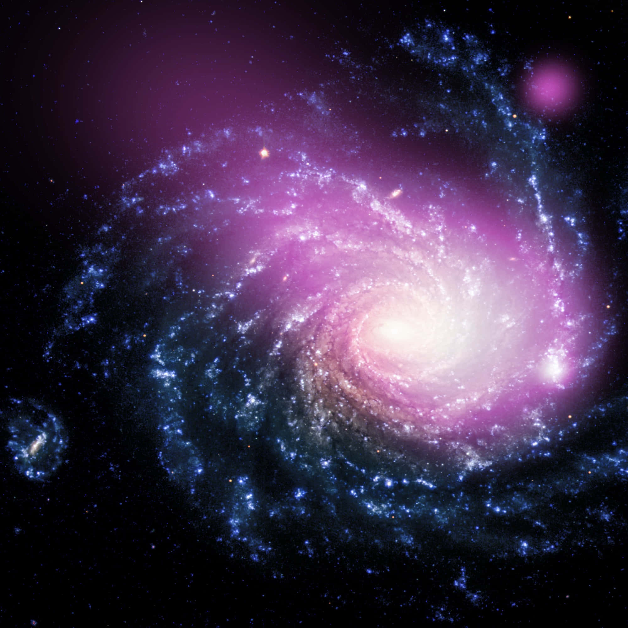 宇宙的壯麗景象 壁紙 — 一個令人嘆為觀止的螺旋星系，在繁星點點的宇宙背景下，旋轉著充滿活力的紫色和藍色色調。