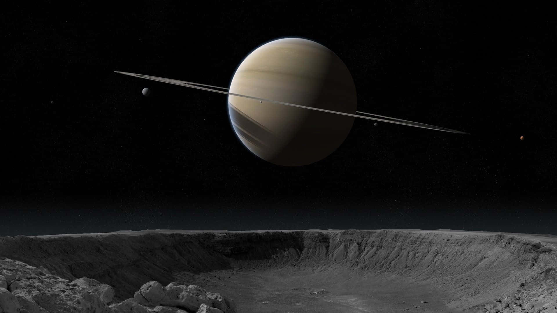土星 桌布 壁紙 — 宏偉的土星及其標誌性的光環主宰著崎嶇外星隕石坑景觀上方的宇宙天空。
