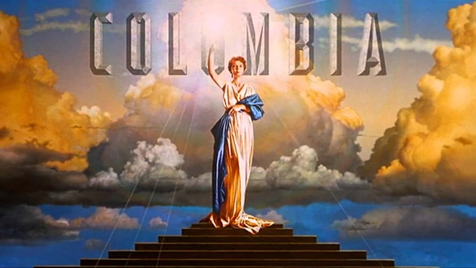 階梯上的女神形象，金色雲彩下，上方有 'COLUMBIA' 標誌。