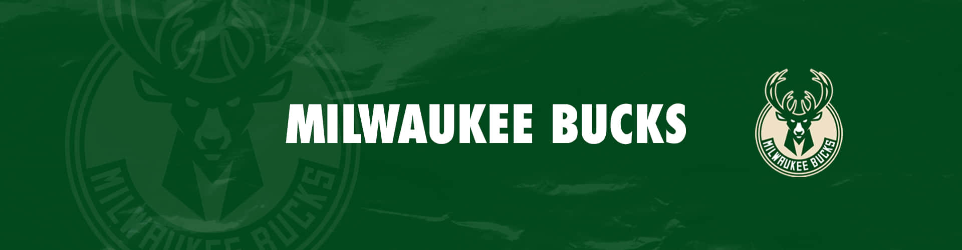 Milwaukee Bucks 籃球隊標誌及名稱在綠色背景上。