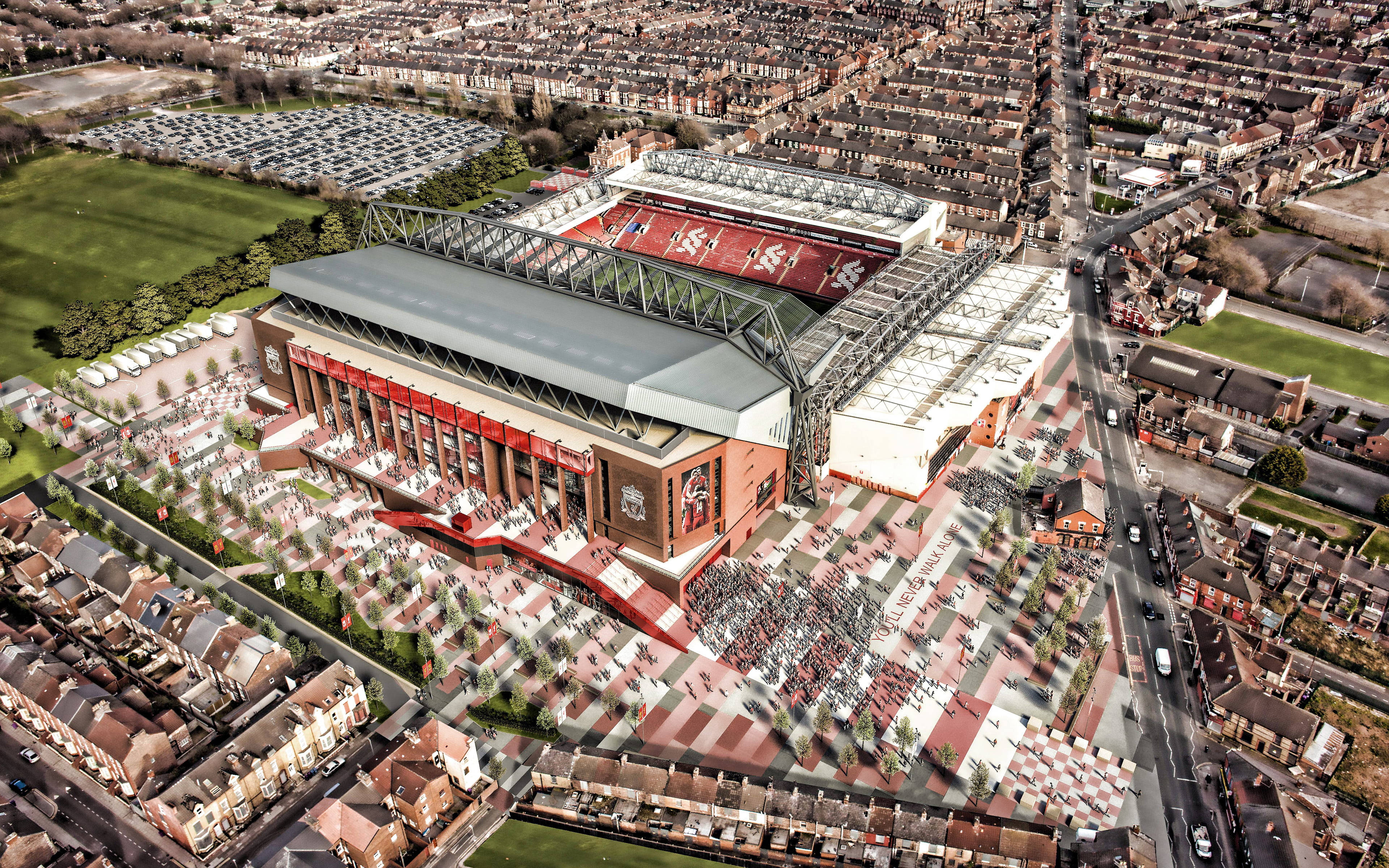 Liverpool Fc 桌布 壁紙 — 密集的城市住宅和綠地環繞的巨大紅白足球場的鳥瞰圖。