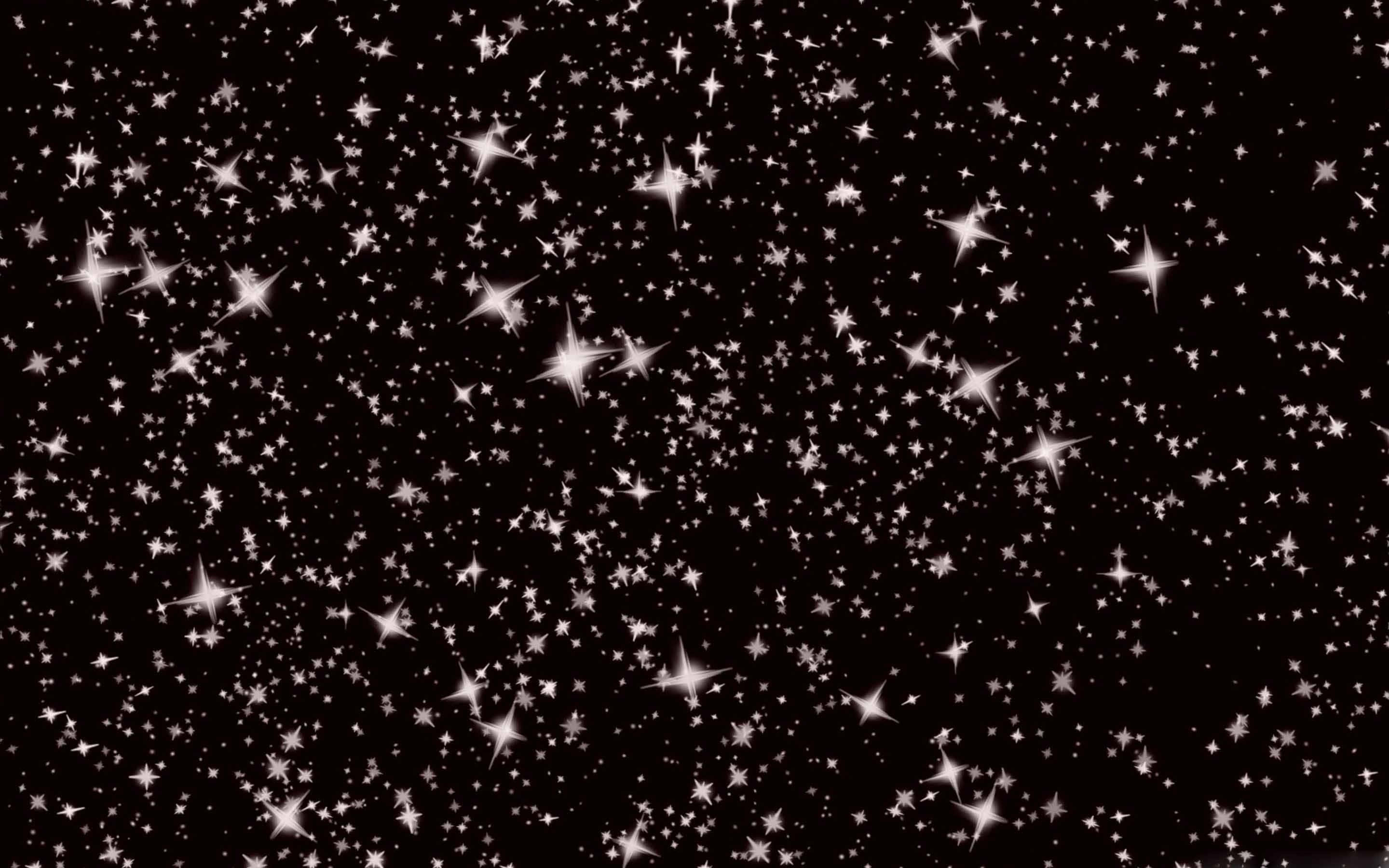 Dark Christmas 桌布 壁紙 — 密集的閃爍白色星星在深邃的黑色宇宙背景上閃耀。