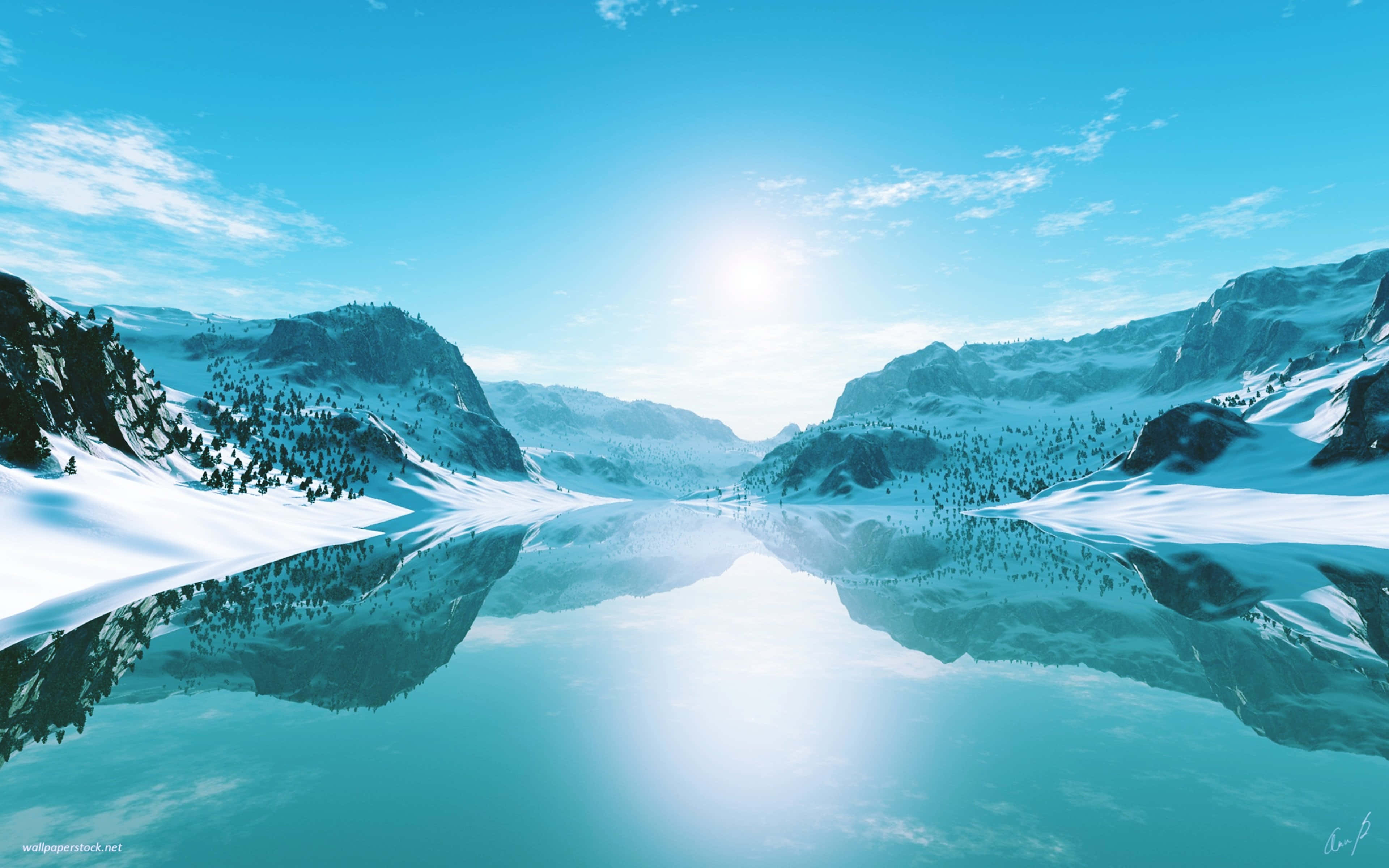 寒冷晴朗的冬季山景 壁紙 — 積雪的山峰在晴朗藍天和零星白雲下，完美倒映在平靜的碧綠湖水中。
