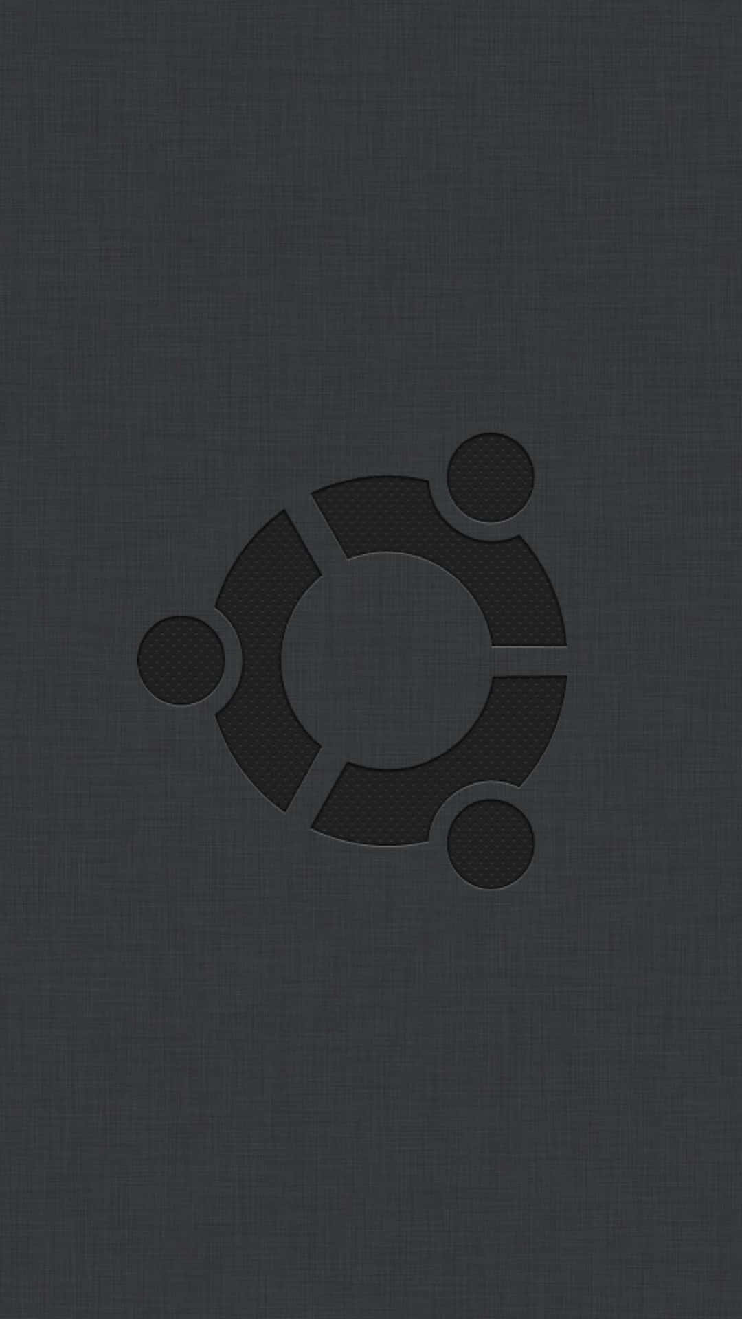 深色紋理布料背景上的 Ubuntu 標誌