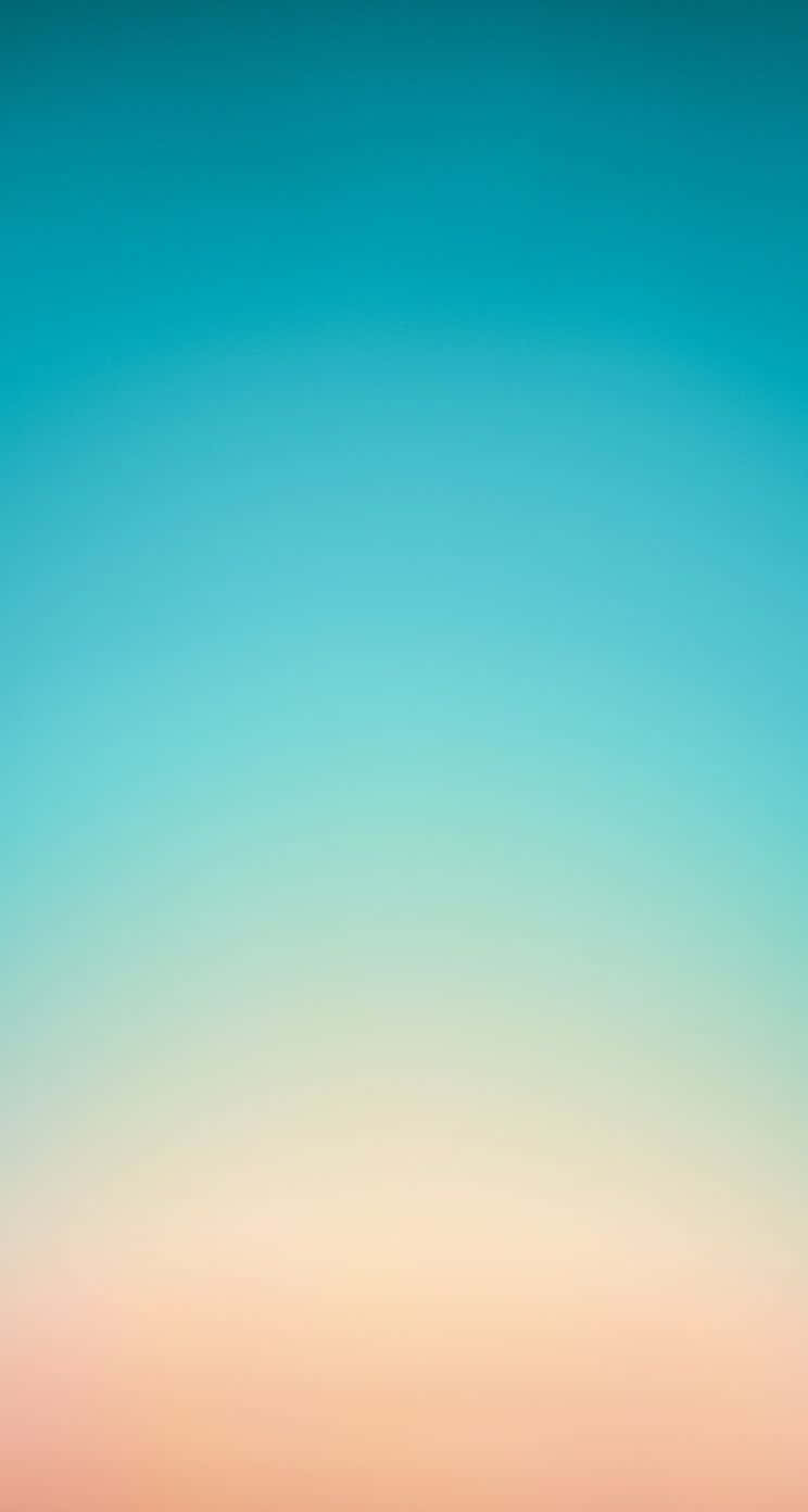 iPhone 5c 桌布 壁紙 — 寧靜的漸變天空，從藍綠色過渡到地平線上的柔和蜜桃色。