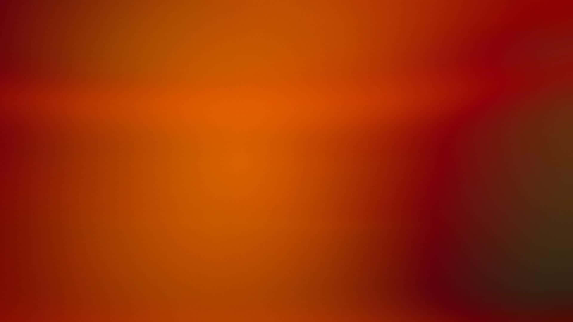 溫暖橙色與紅色調的抽象漸變背景。