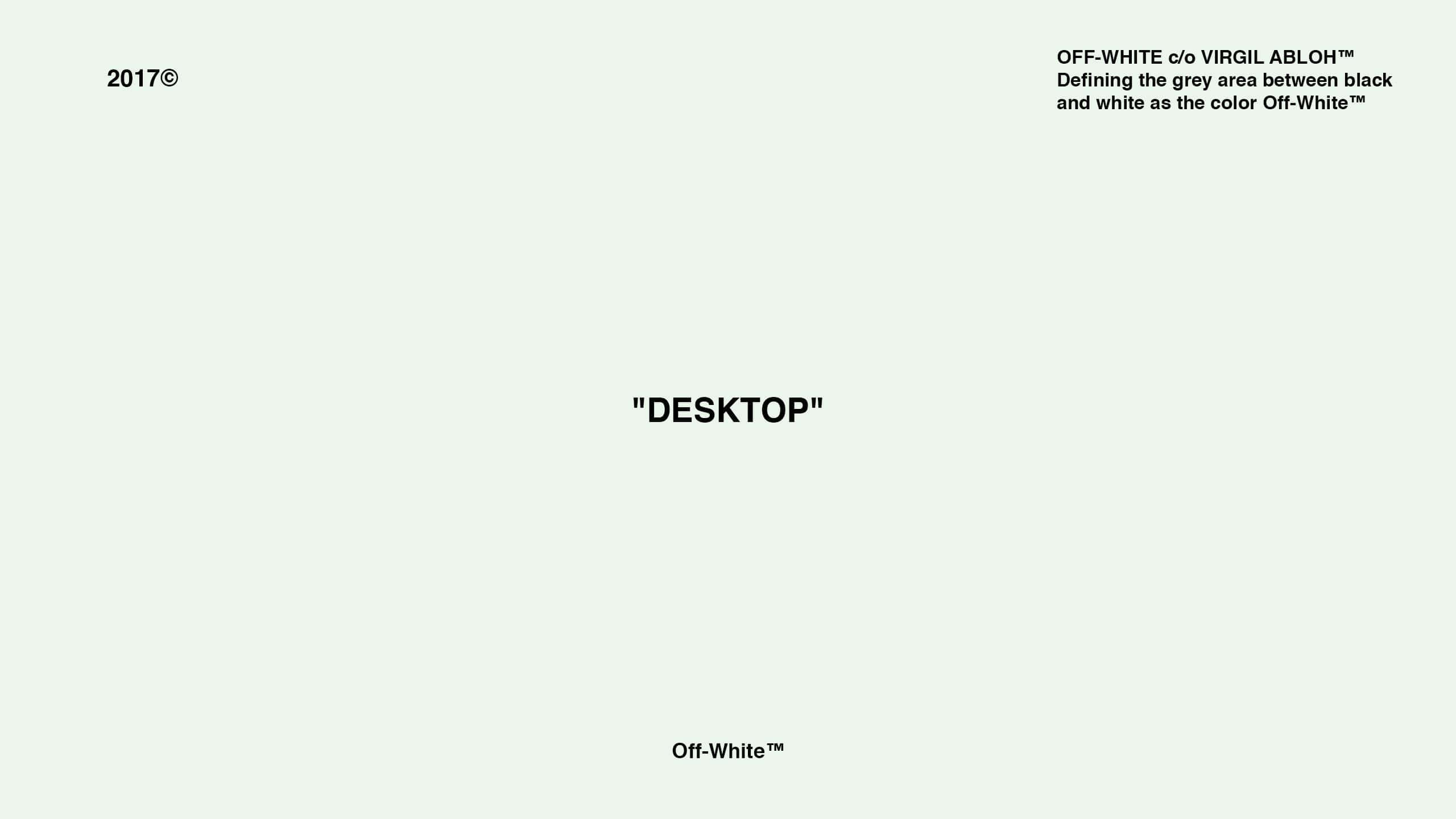 寧靜米白色桌面 壁紙 — 簡約米白色背景，中央黑色文字寫著「DESKTOP」，角落有品牌標誌。