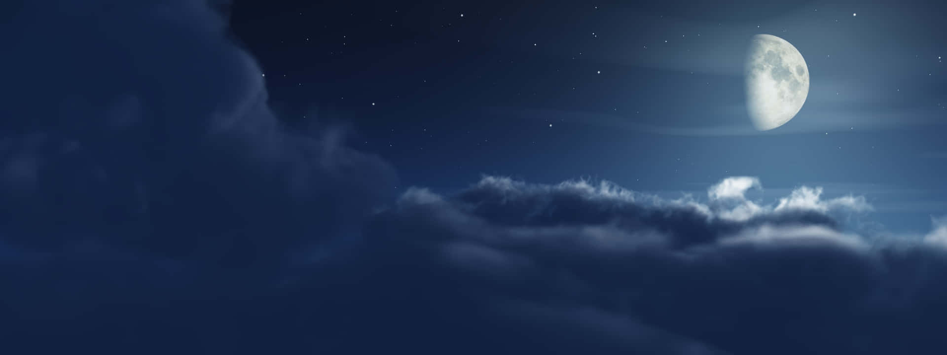 夜晚飄動的雲層之上的彎月和星星。