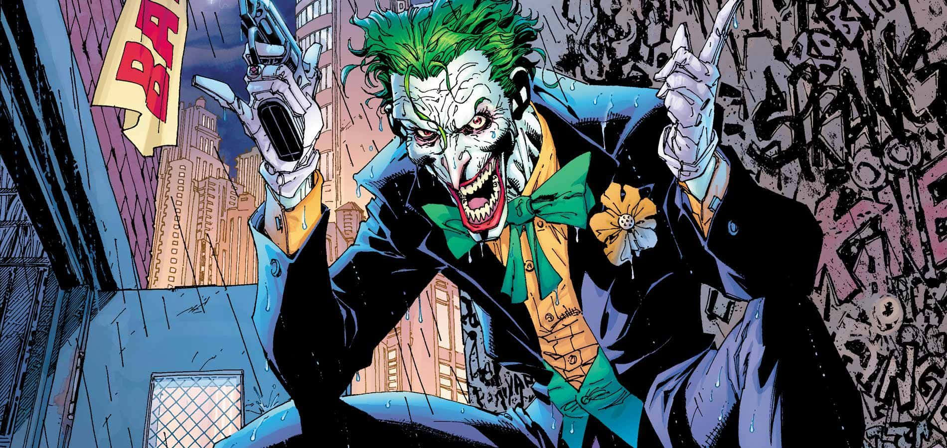 Joker Comic 桌布 壁紙 — 小丑在濕透的都市小巷中狂笑，手持兩把手槍，身後是佈滿塗鴉的牆壁。