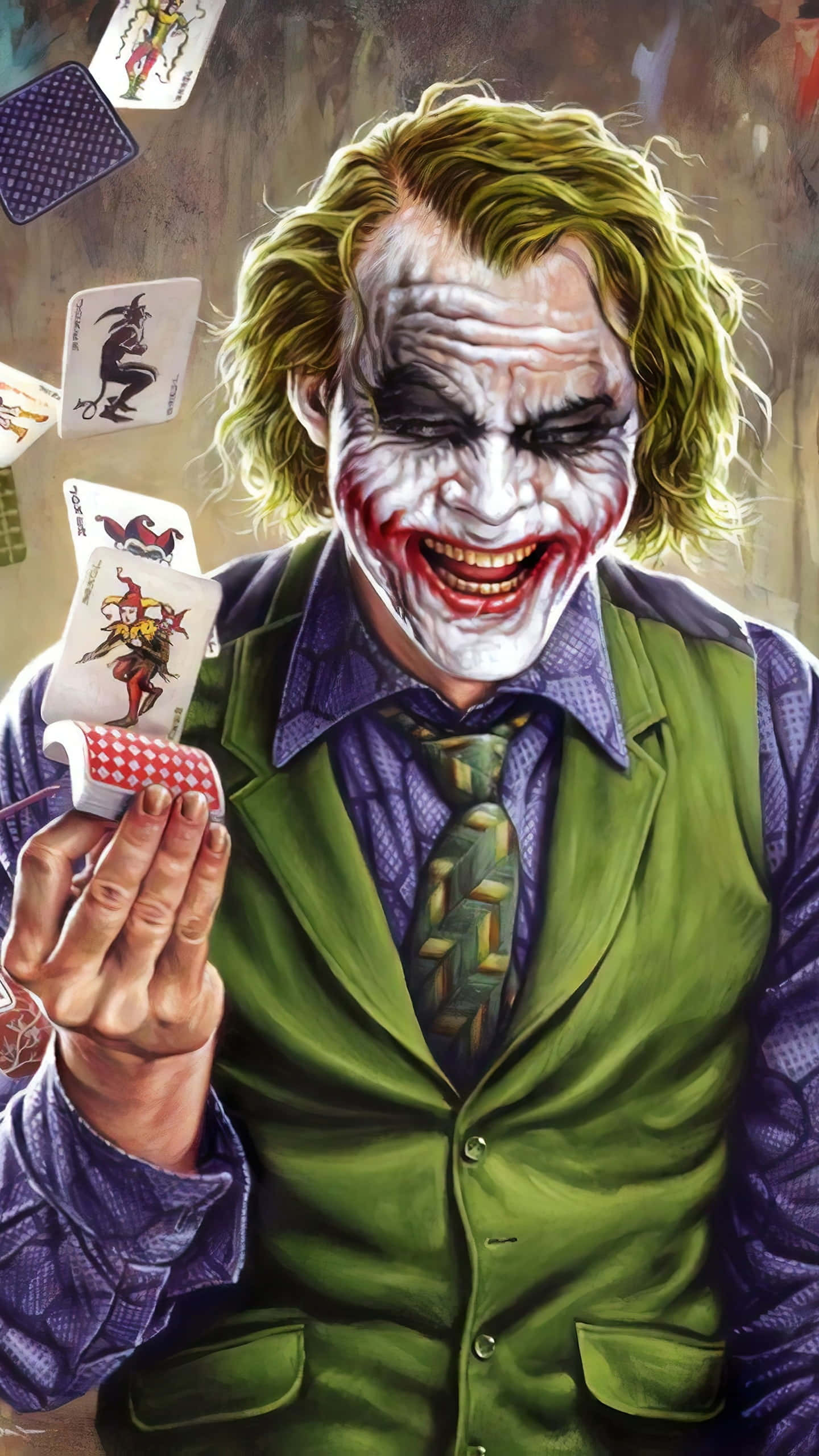 Joker Laughing 桌布 壁紙 — 小丑狂笑著，手持一副撲克牌，周圍漂浮著小丑撲克牌。