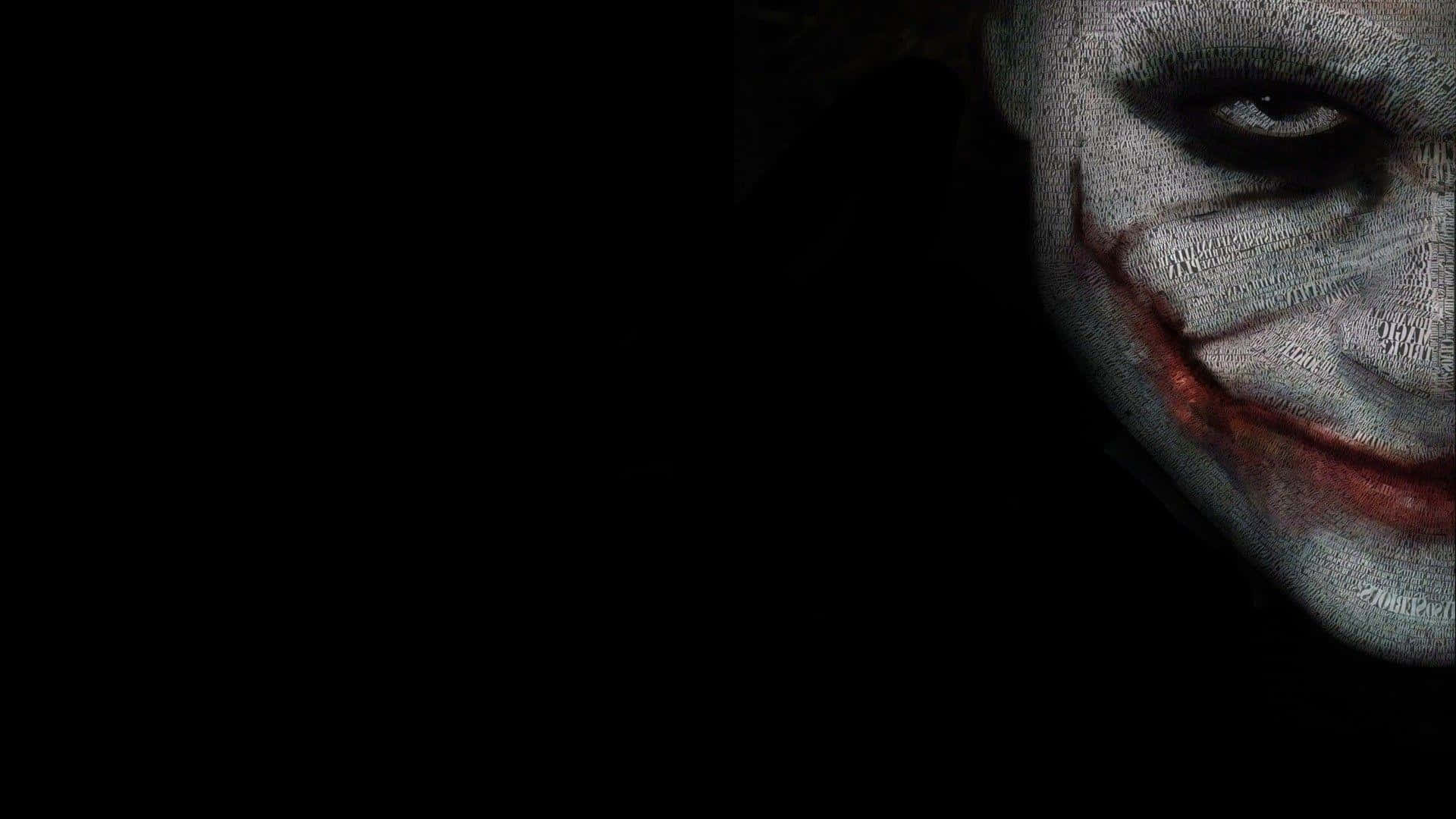 Villain 桌布 壁紙 — 小丑臉部的威脅性特寫，白色化妝和紅色嘴唇，背景黑暗。