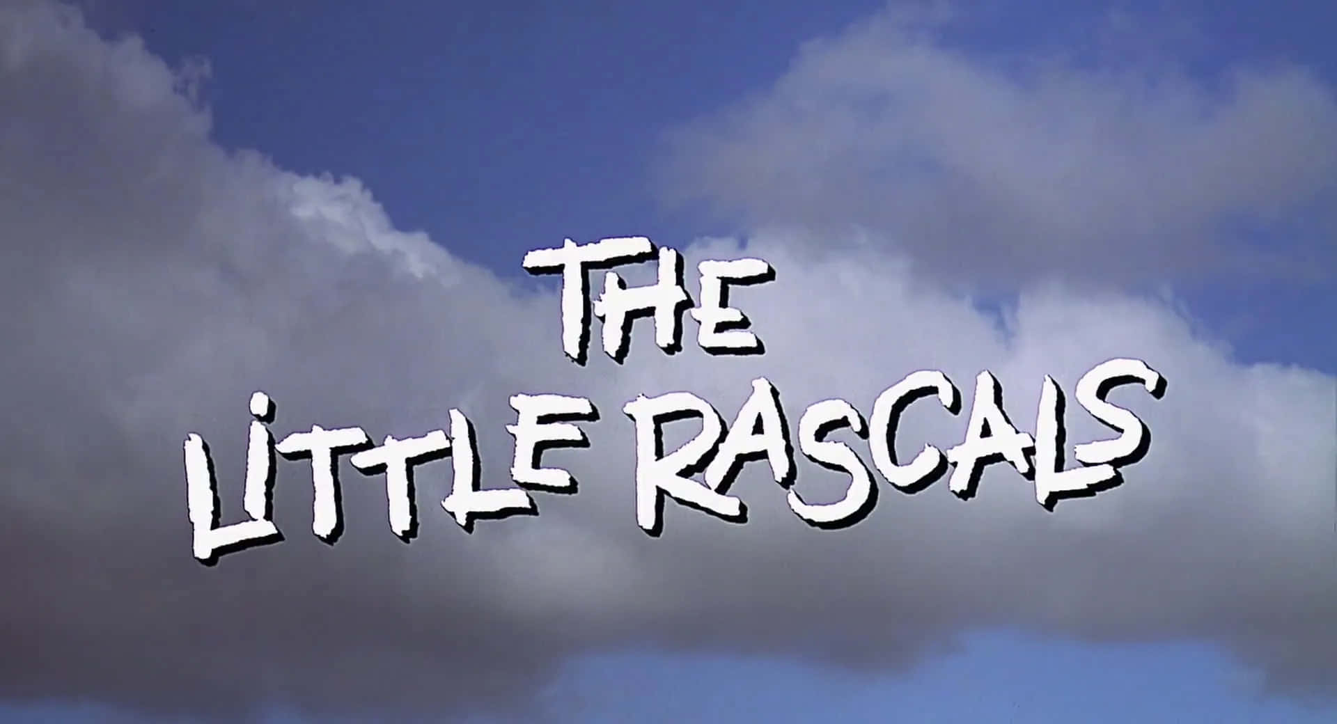 The Little Rascals 標題卡，在多雲天空背景下帶有大膽的白色文字。