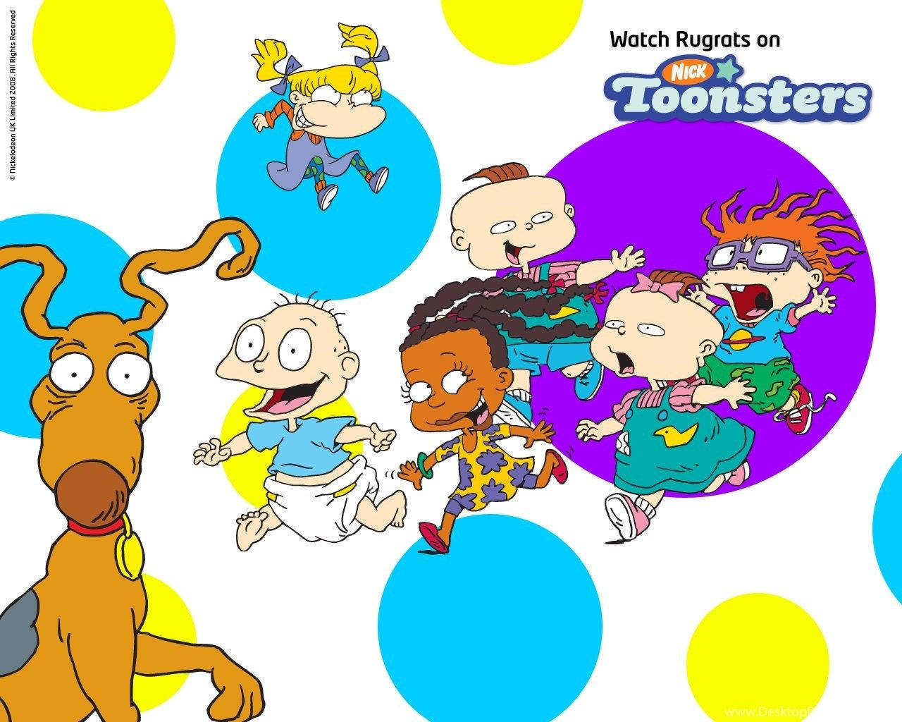 Rugrats 角色和他們的狗在色彩繽紛的圓點背景上玩耍。